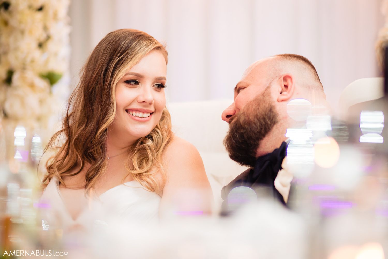 Close up romantic wedding portraits in soft natural lighting show tender moments between newlyweds.