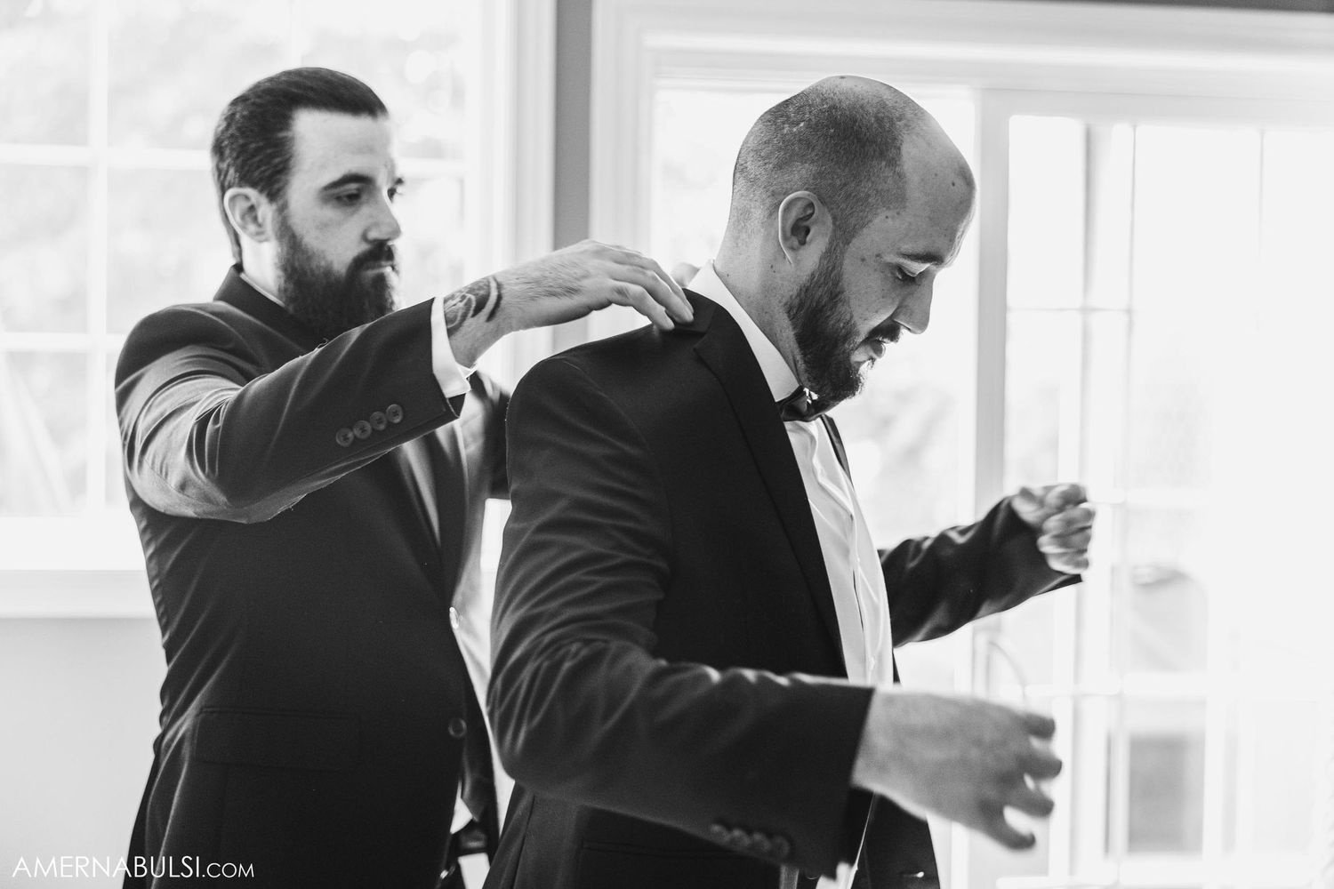 Final adjustments being made to formal attire before a special event.