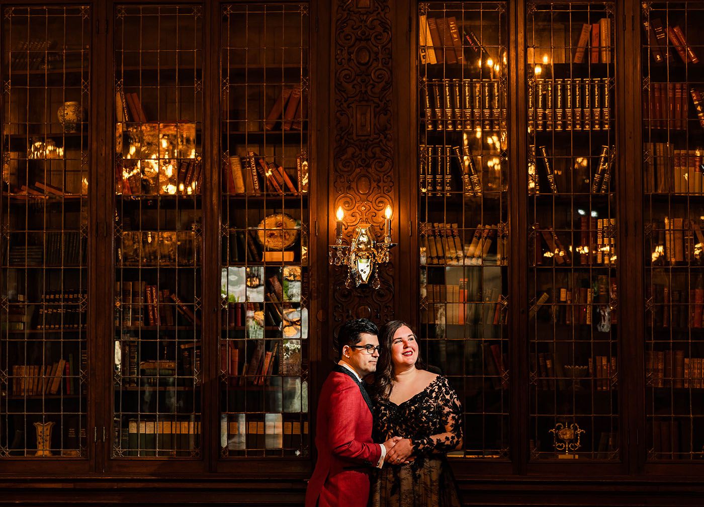 Elegant interior of historic building with ornate woodwork and warm lighting.