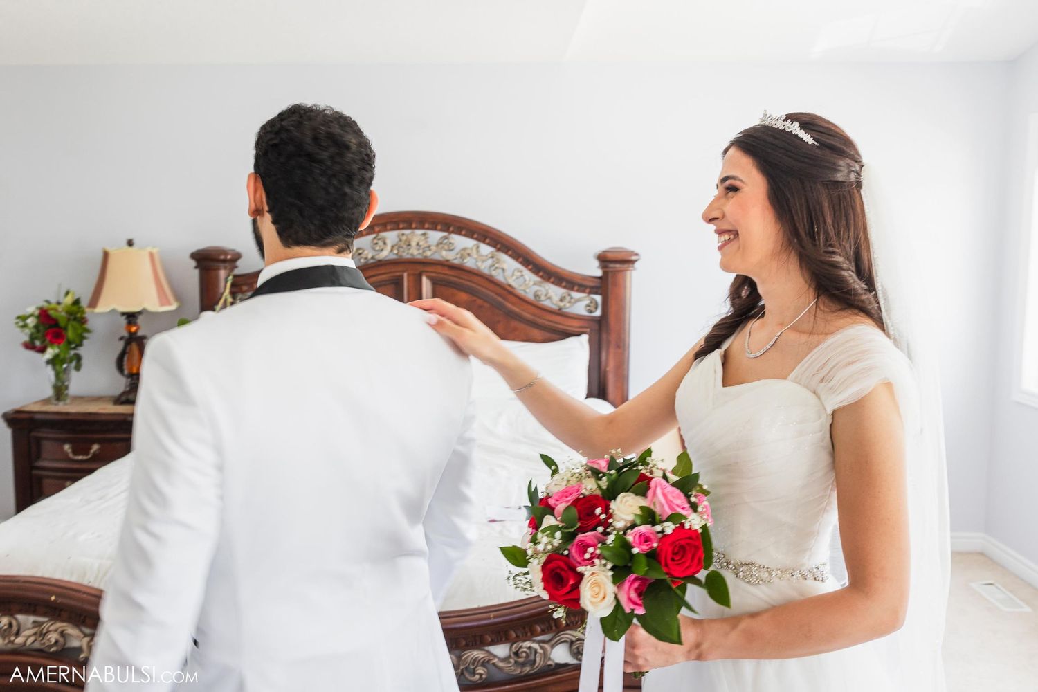 A couple sharing a playful moment during their wedding photoshoot.