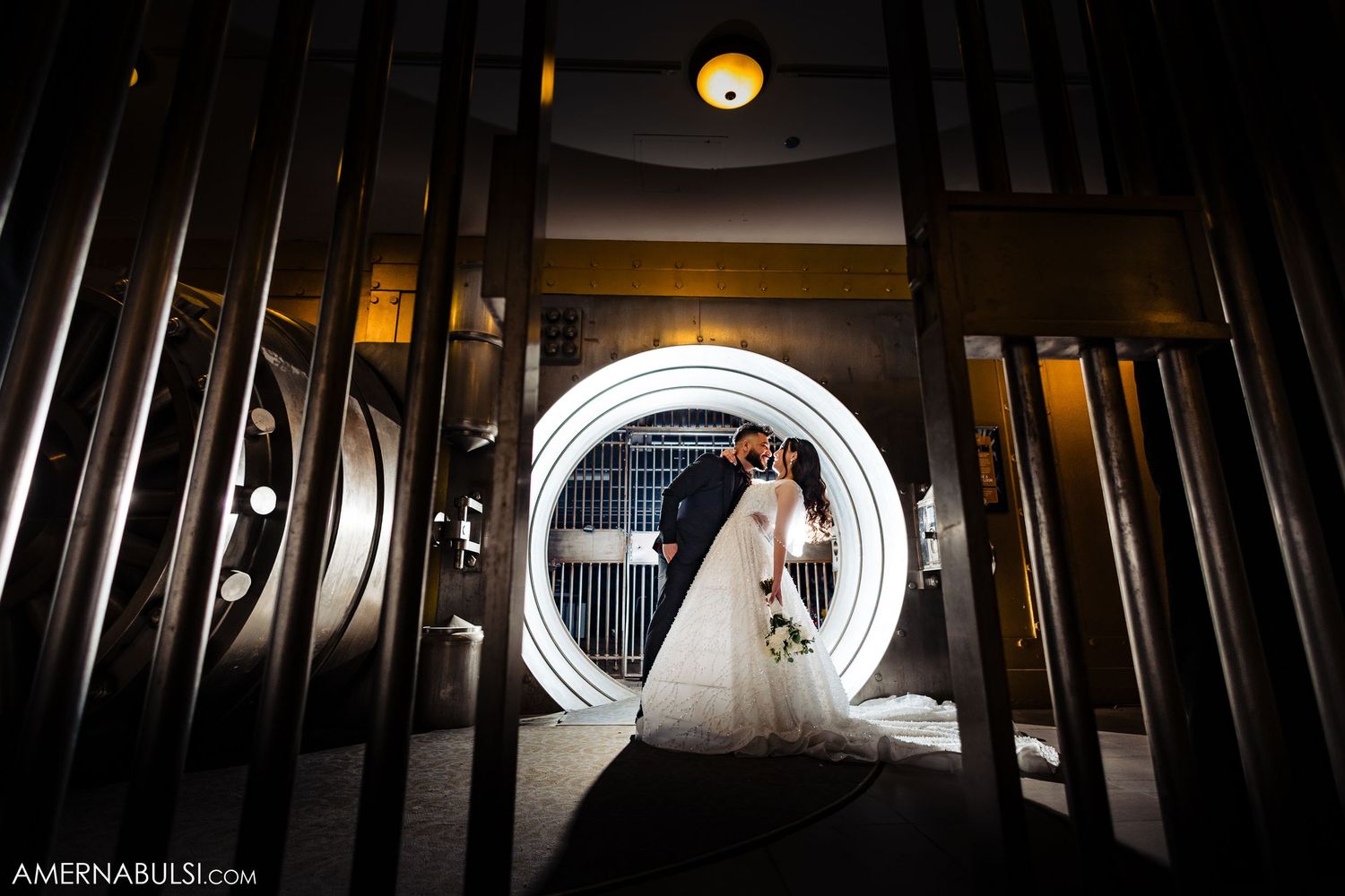 Artistic wedding photography using dramatic shadows and light through industrial-style architecture.