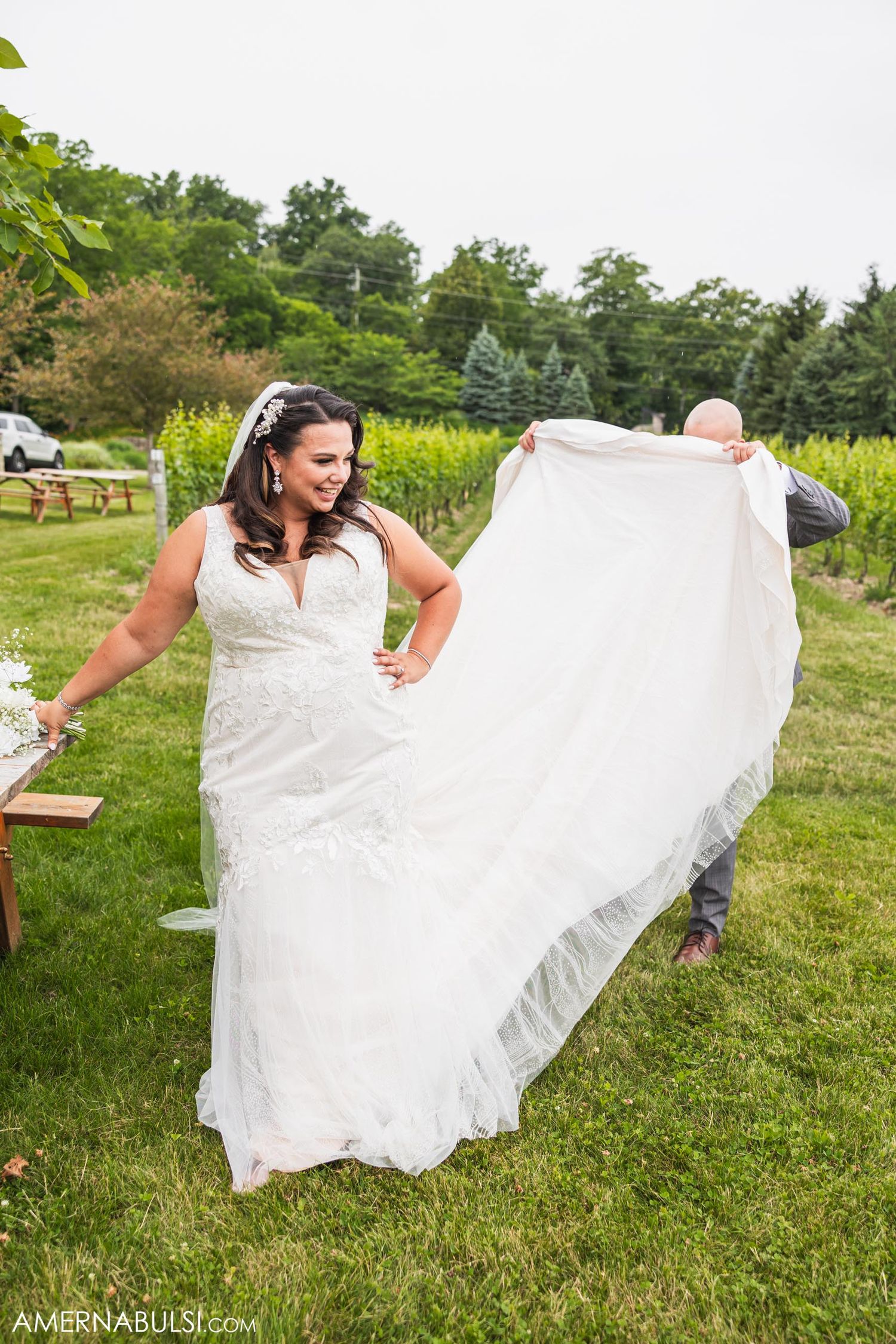 Wedding dress flowing in the wind during outdoor portrait session.