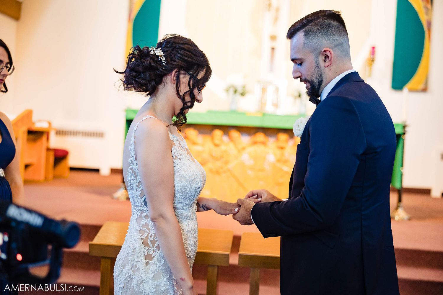Exchange of rings during traditional church wedding ceremony.