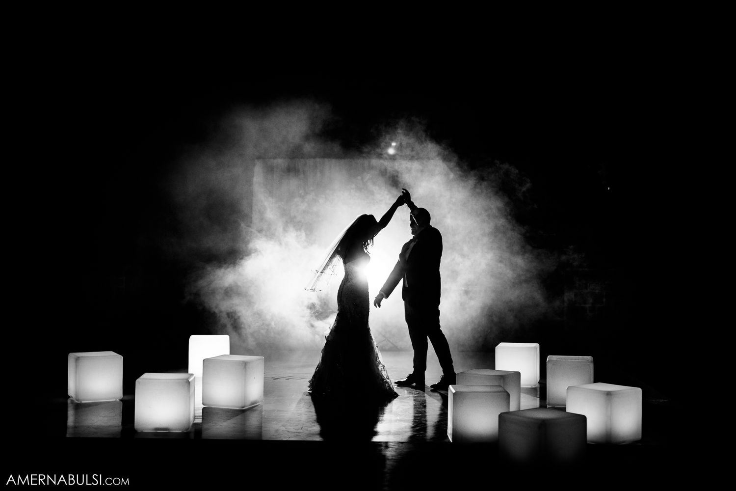 Artistic black and white silhouettes of couples with glowing light boxes creating romantic ambiance.