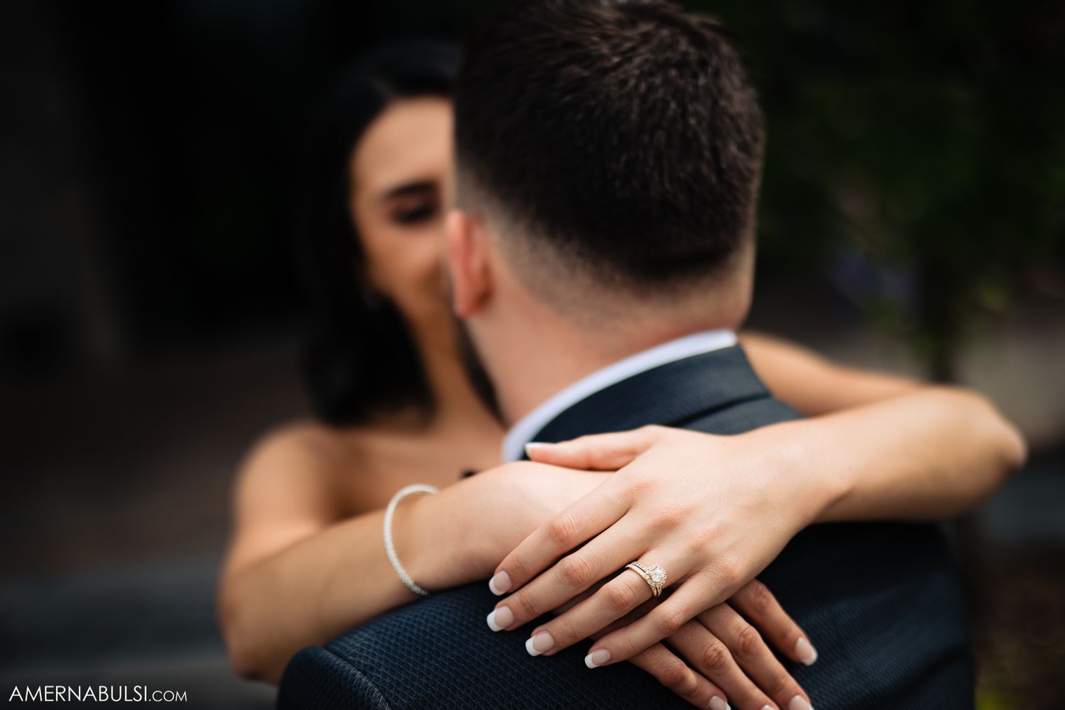 Guests hug and share emotional moments during a wedding reception celebration.