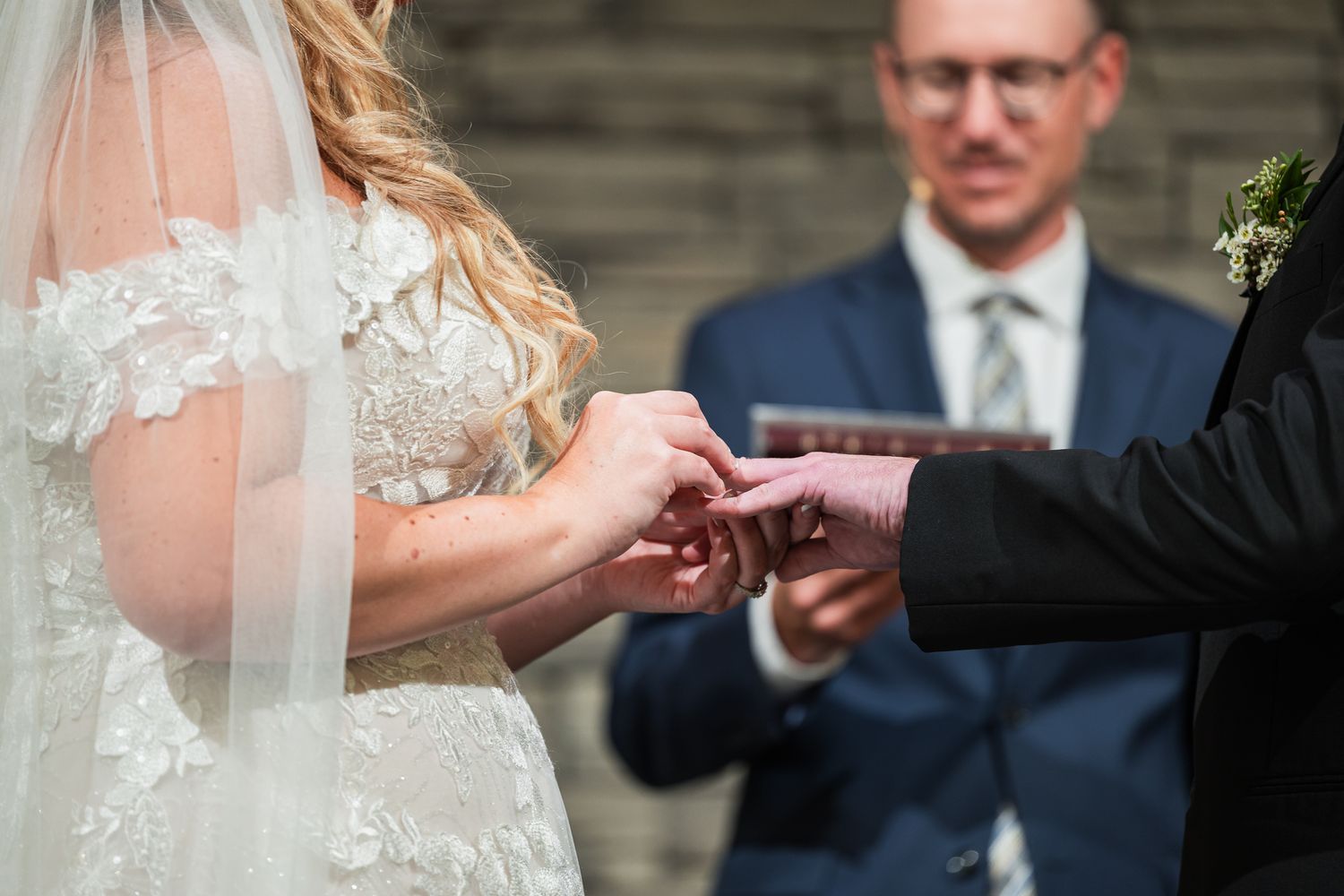 Wedding couple shares intimate moment during first dance at elegant indoor reception.
