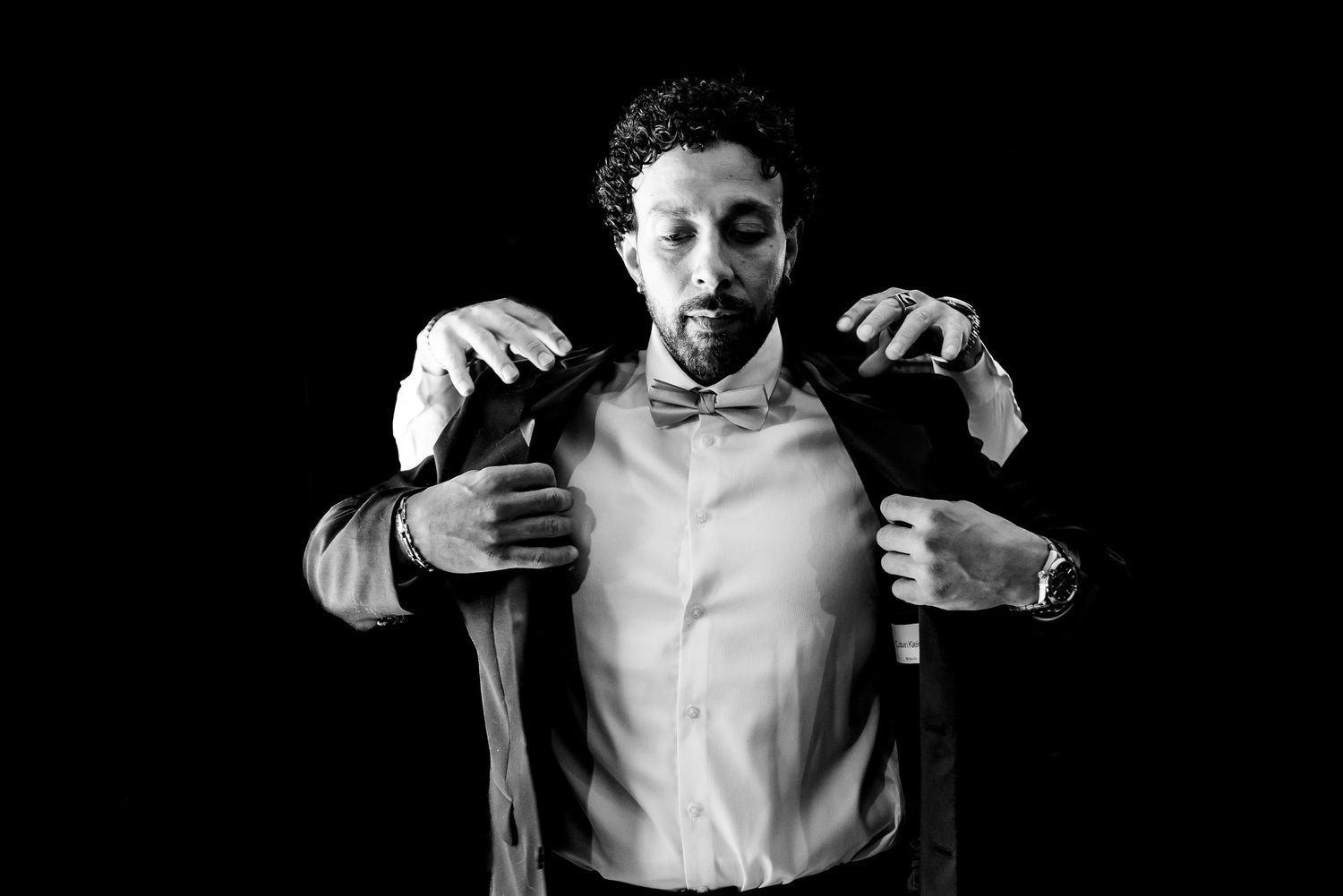 Dramatic black and white portrait series capturing intimate moments between a couple.