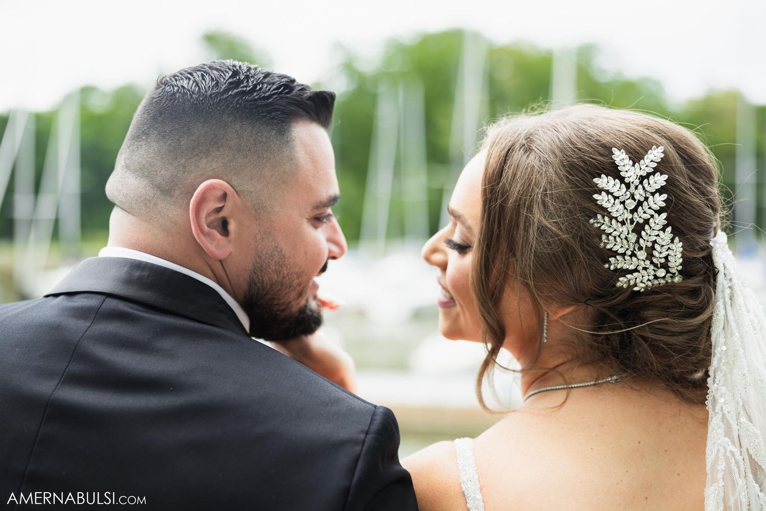 Romantic wedding portrait showing delicate lace hair accessory against soft natural background.