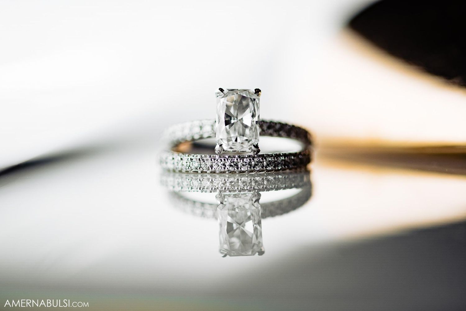 Close-up detail shot of sparkly diamond engagement and wedding ring set.