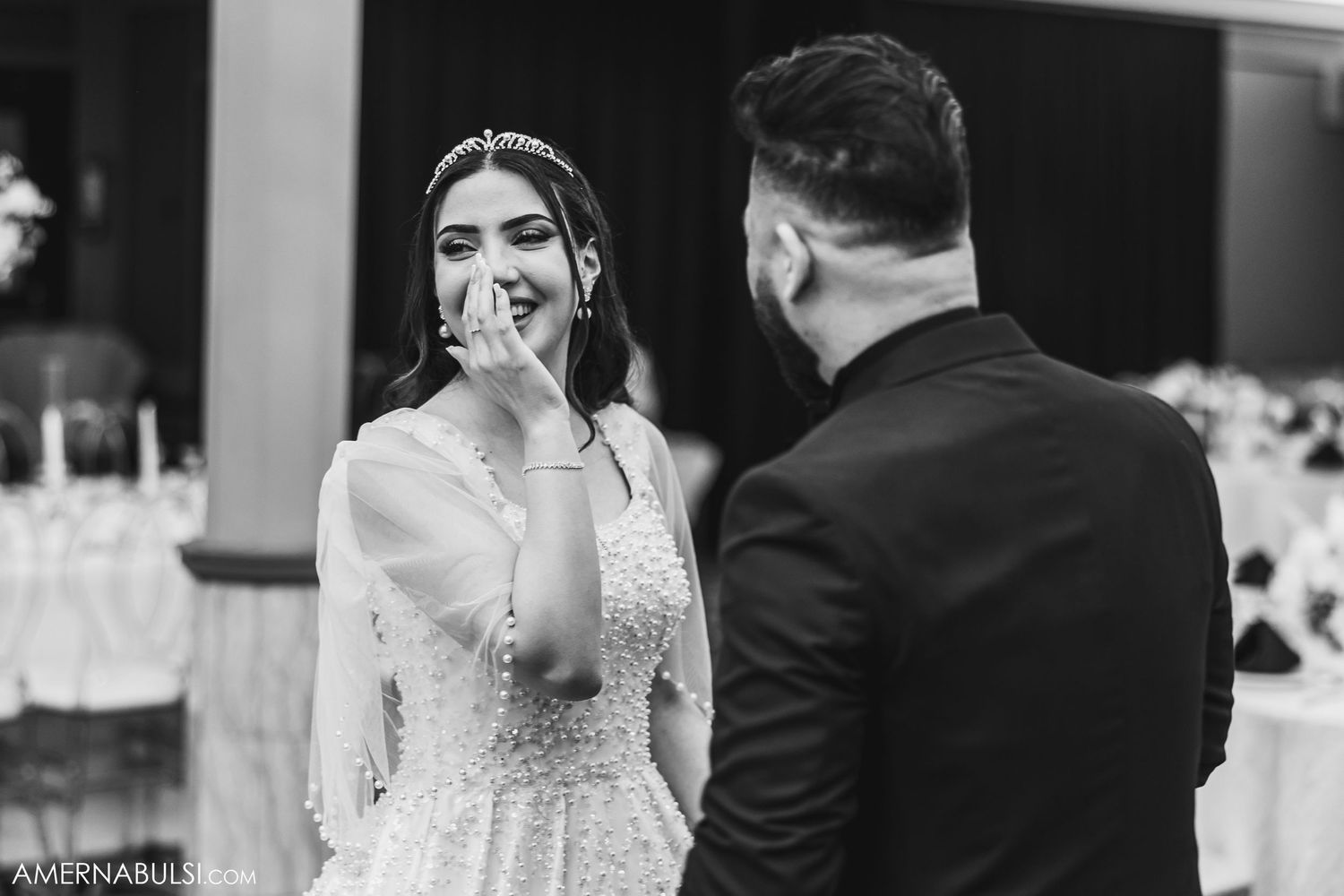 An emotional black and white moment captured during a wedding ceremony.