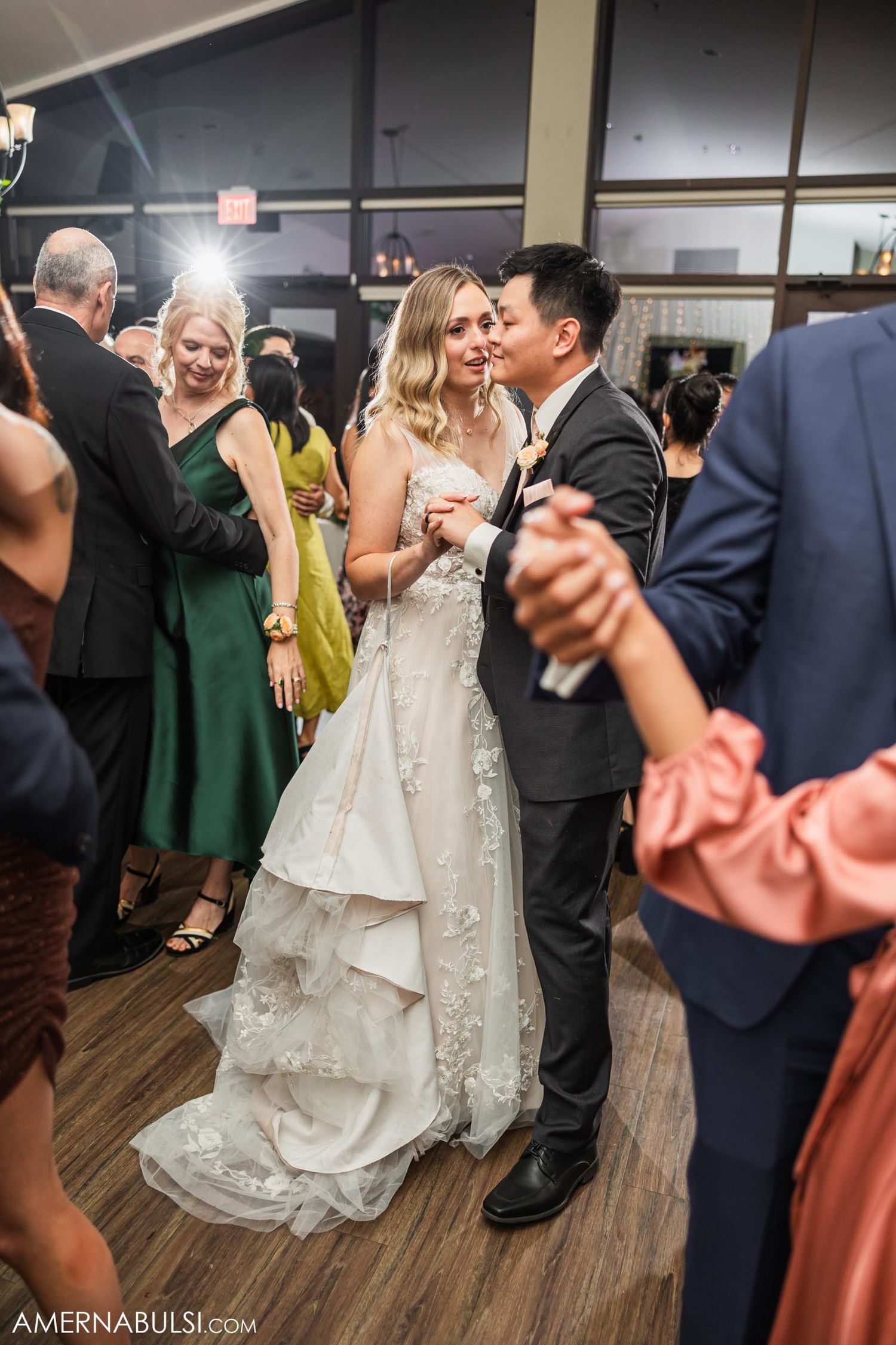 A couple shares a romantic dance moment at their wedding reception.
