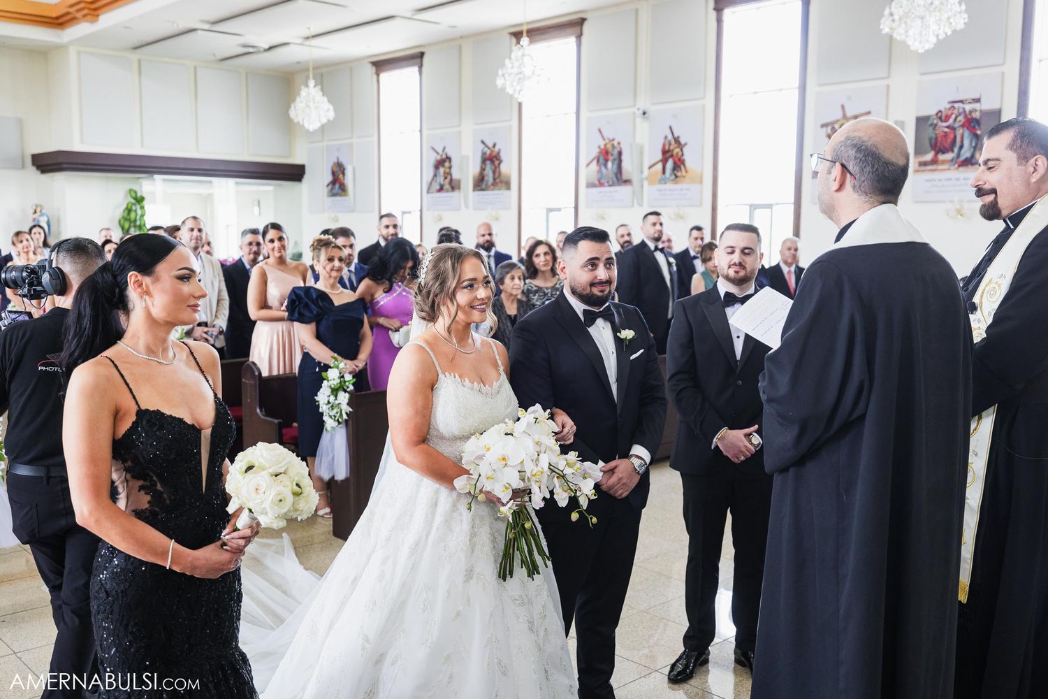 Wedding ceremony in a bright modern room with guests gathered for the exchange of vows.