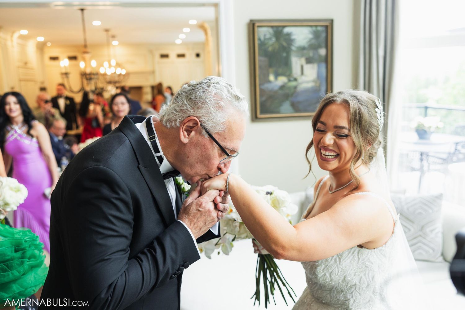 Tender moment between bride and father during wedding reception.