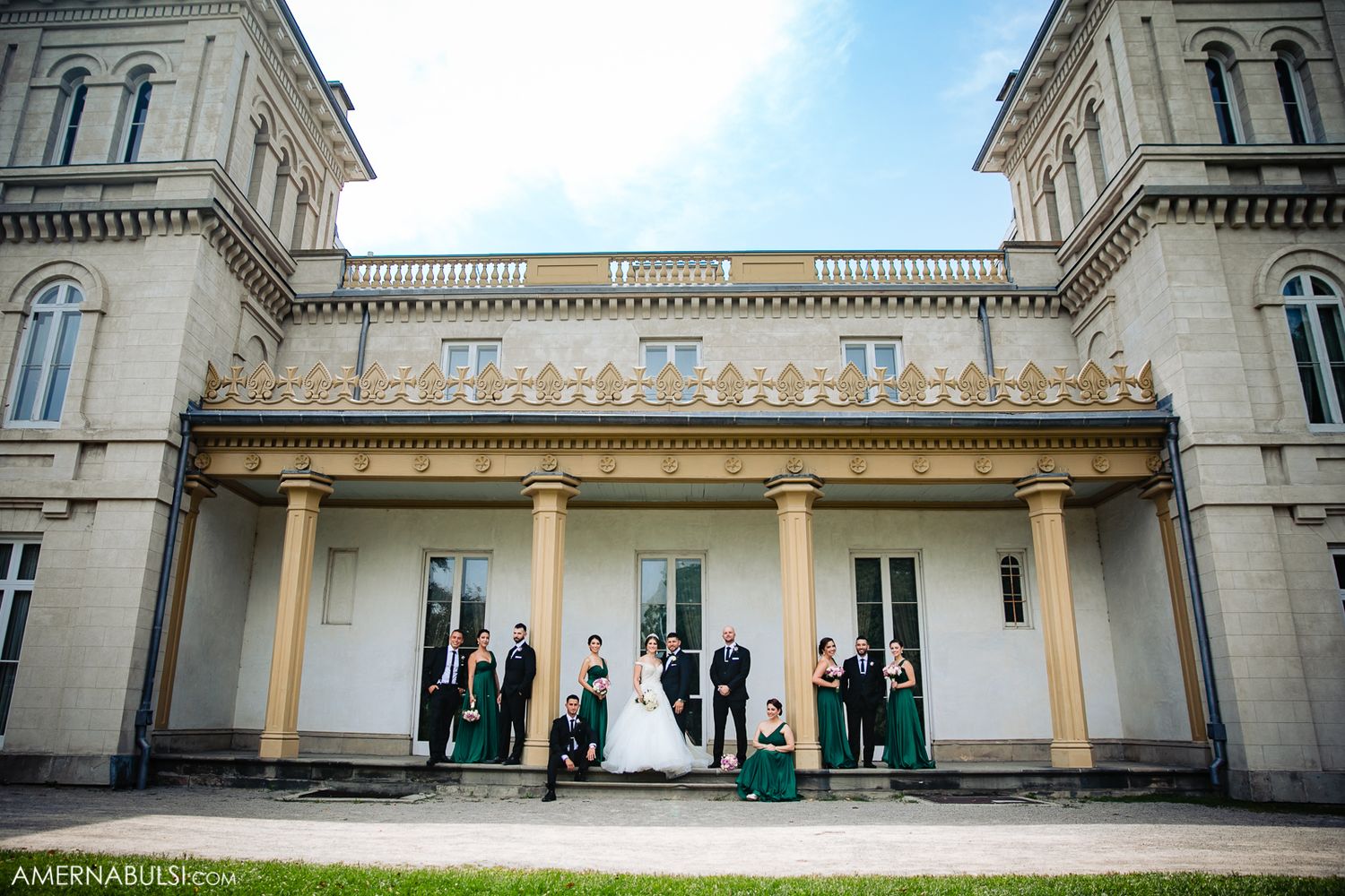 Panoramic view of an elegant historic mansion with classical architecture and columns.