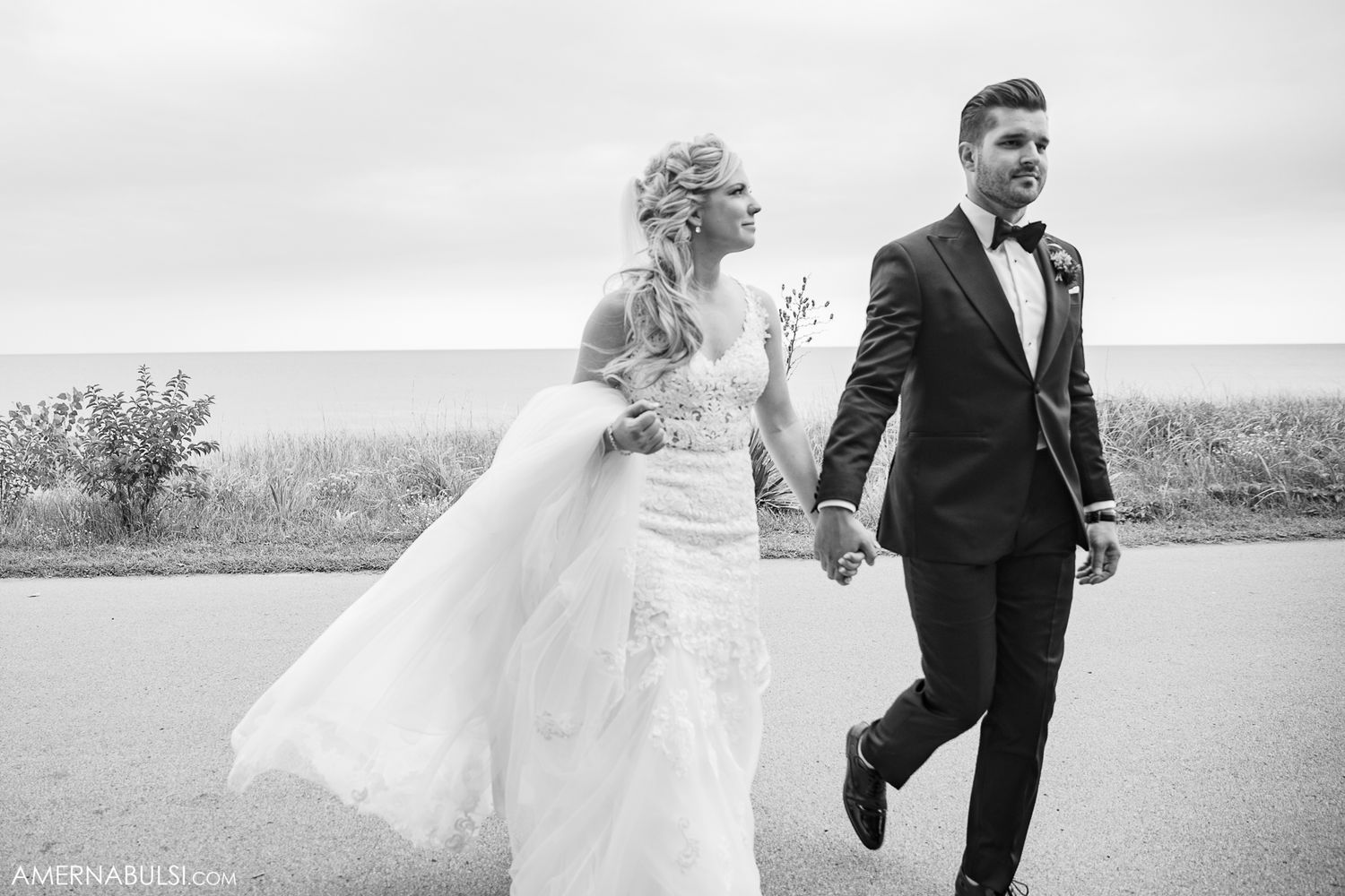 Black and white sequence of couple walking and dancing together in outdoor setting.