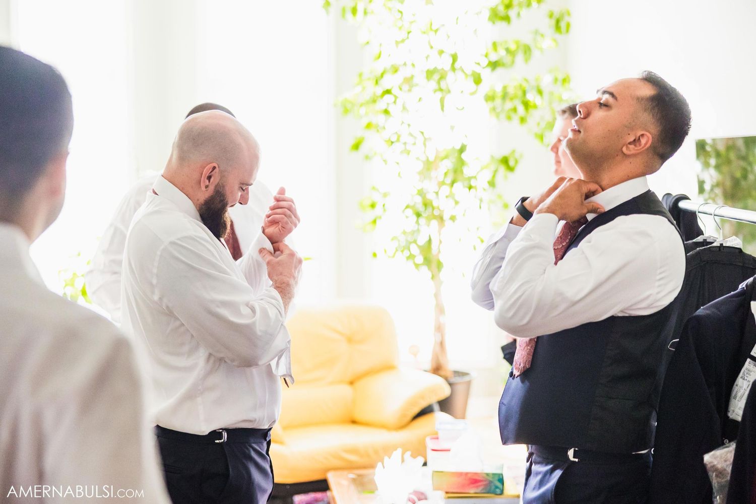 Wedding preparation scene with natural light streaming through windows.