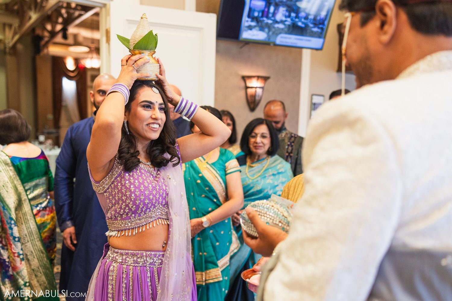 Wedding celebration with guests participating in traditional rituals and customs.
