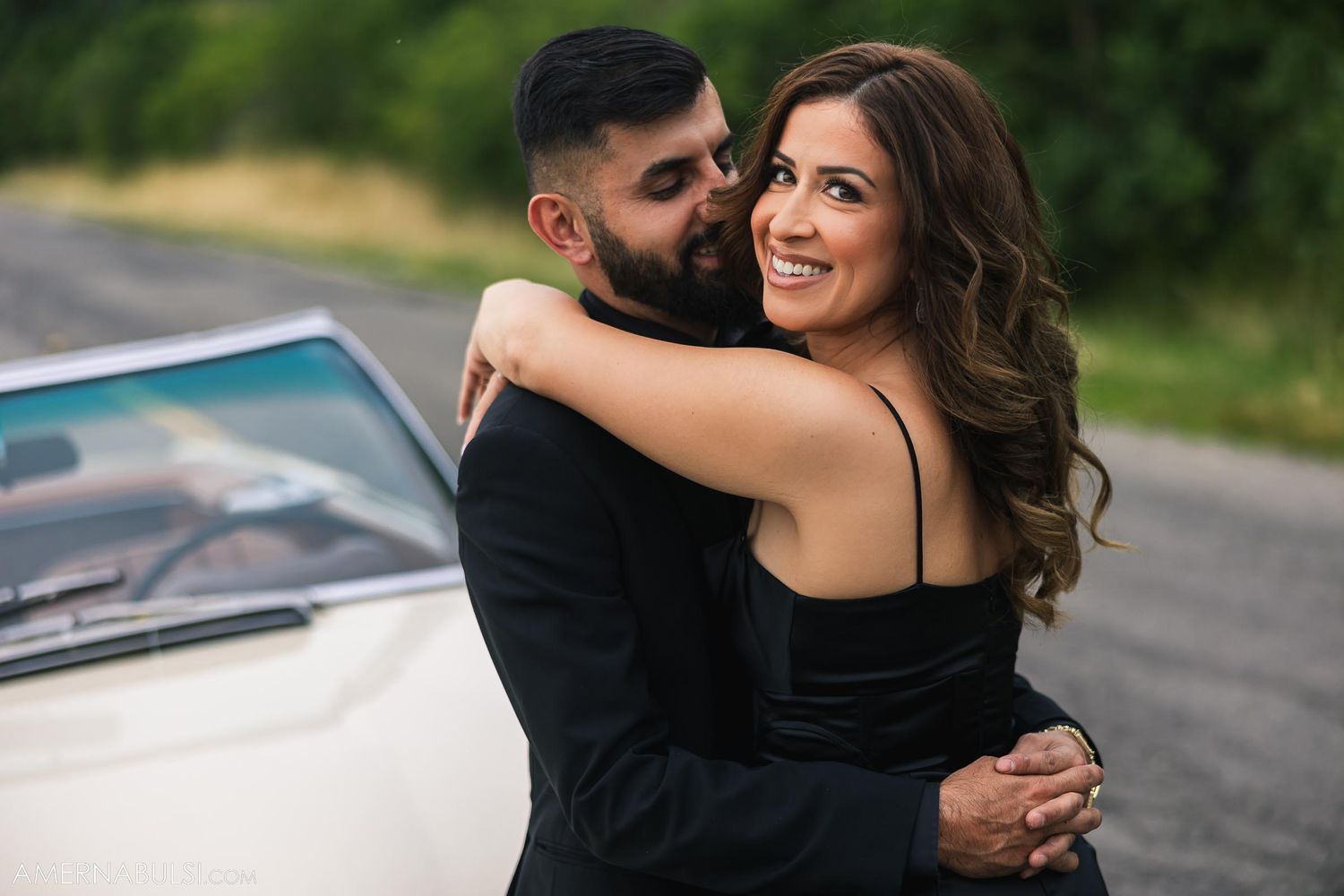 Romantic photoshoot with classic Mercedes-Benz convertible in natural setting.