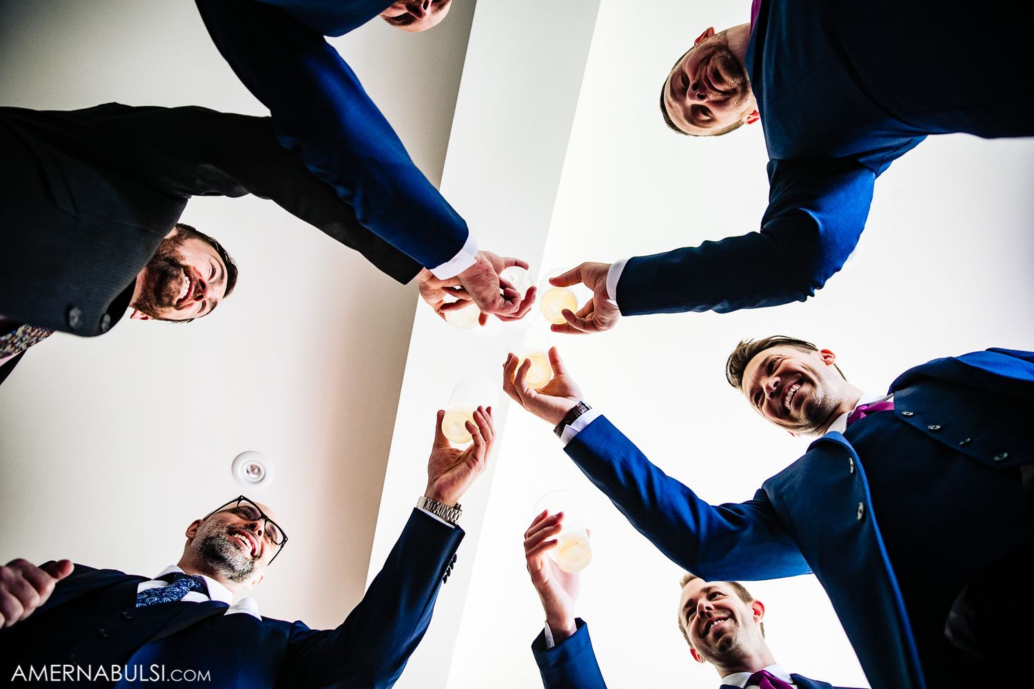 A creative photo sequence showing groomsmen jumping and posing in black and white.