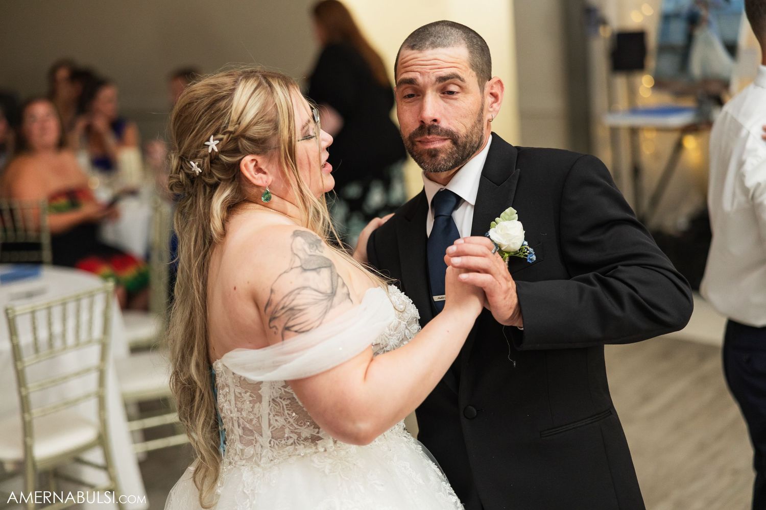 Couple shares intimate dance moments during their wedding reception.
