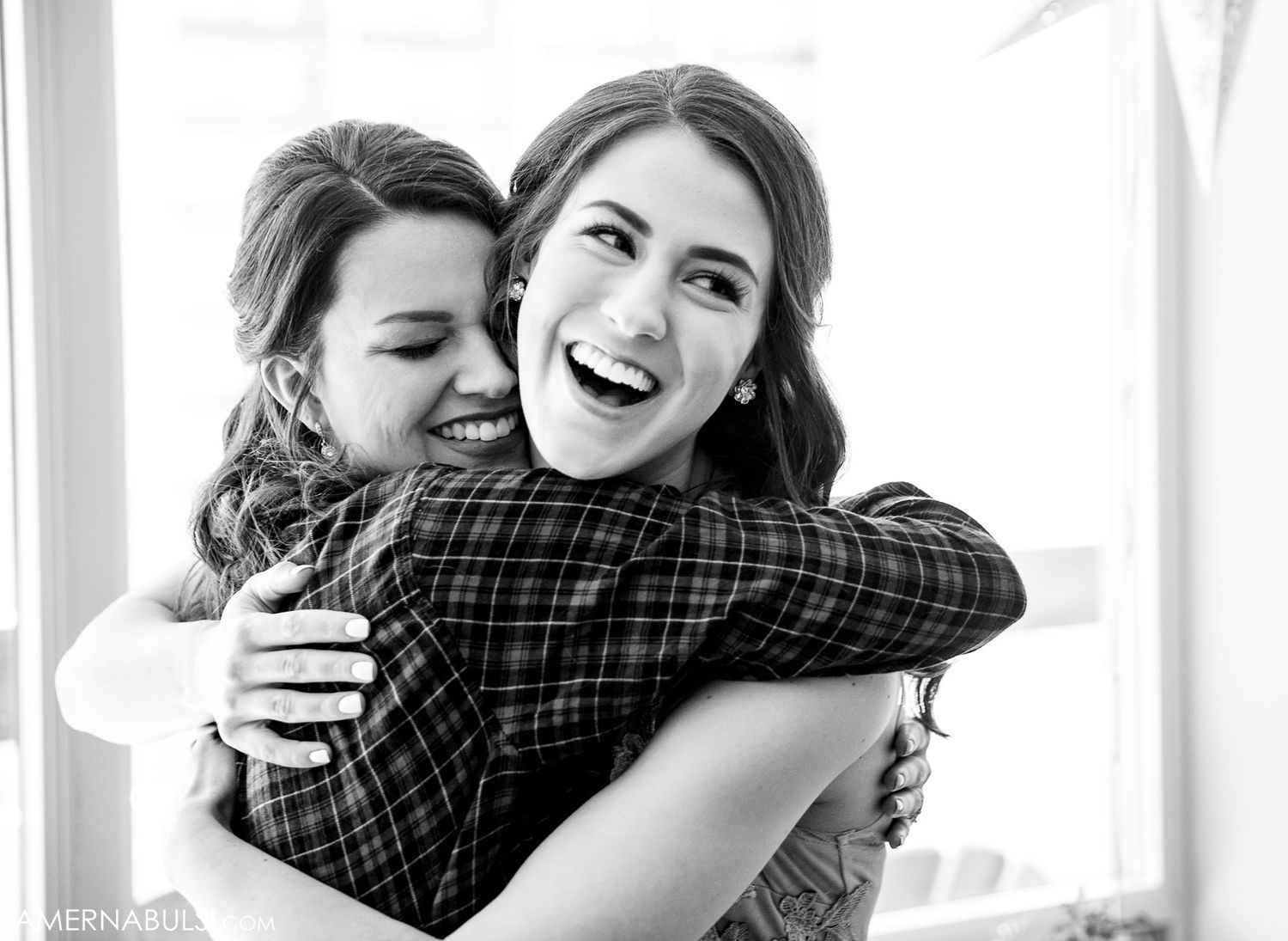 Black and white photos showing joyful embraces and candid moments at a celebration.