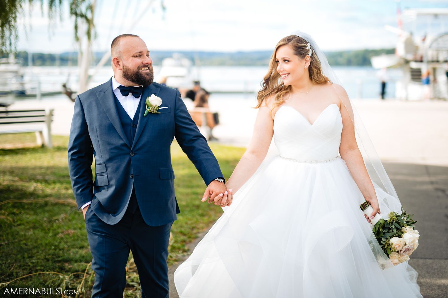 Waterfront wedding photography session with scenic marina views.