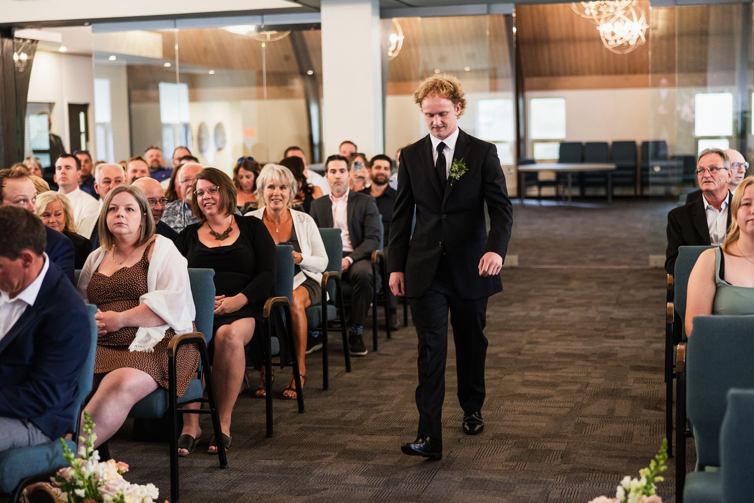 Modern indoor wedding venue with simple decor and natural lighting for ceremony setup.