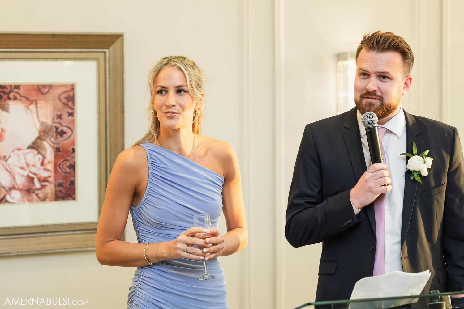 Speakers address wedding guests during reception speeches.