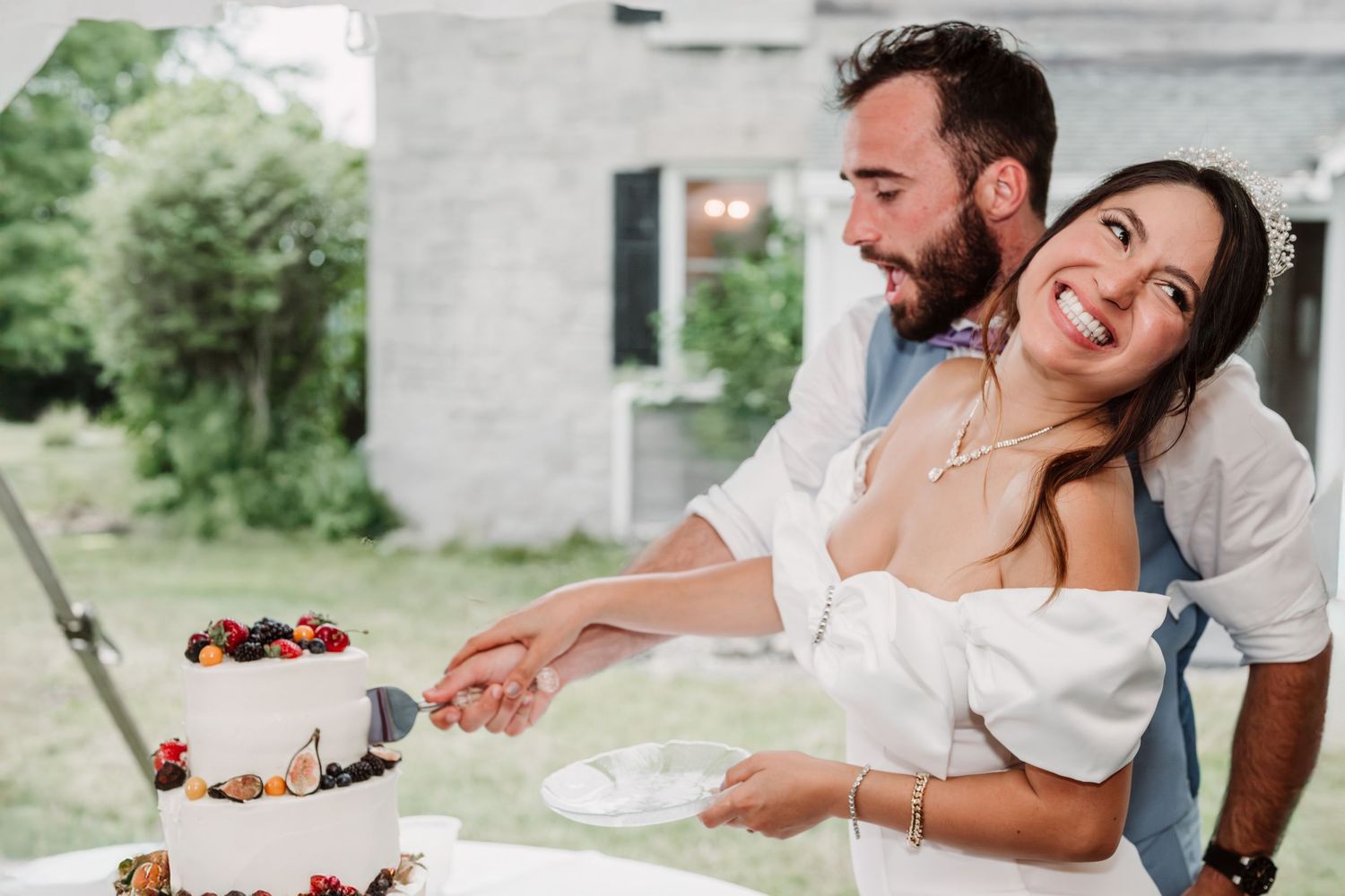 Candid wedding reception moments captured with guests enjoying food and laughter.