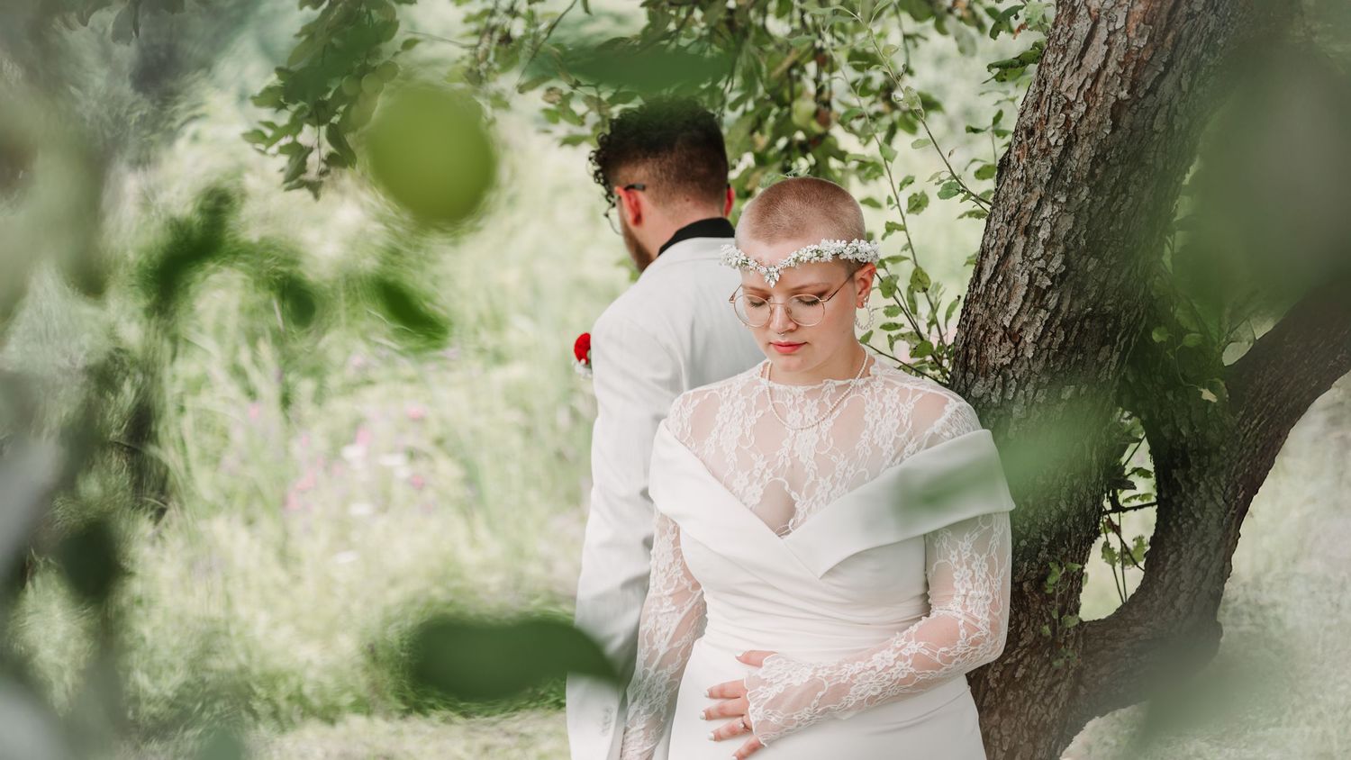 A romantic wedding photo sequence showing joyful moments between a couple under green trees.