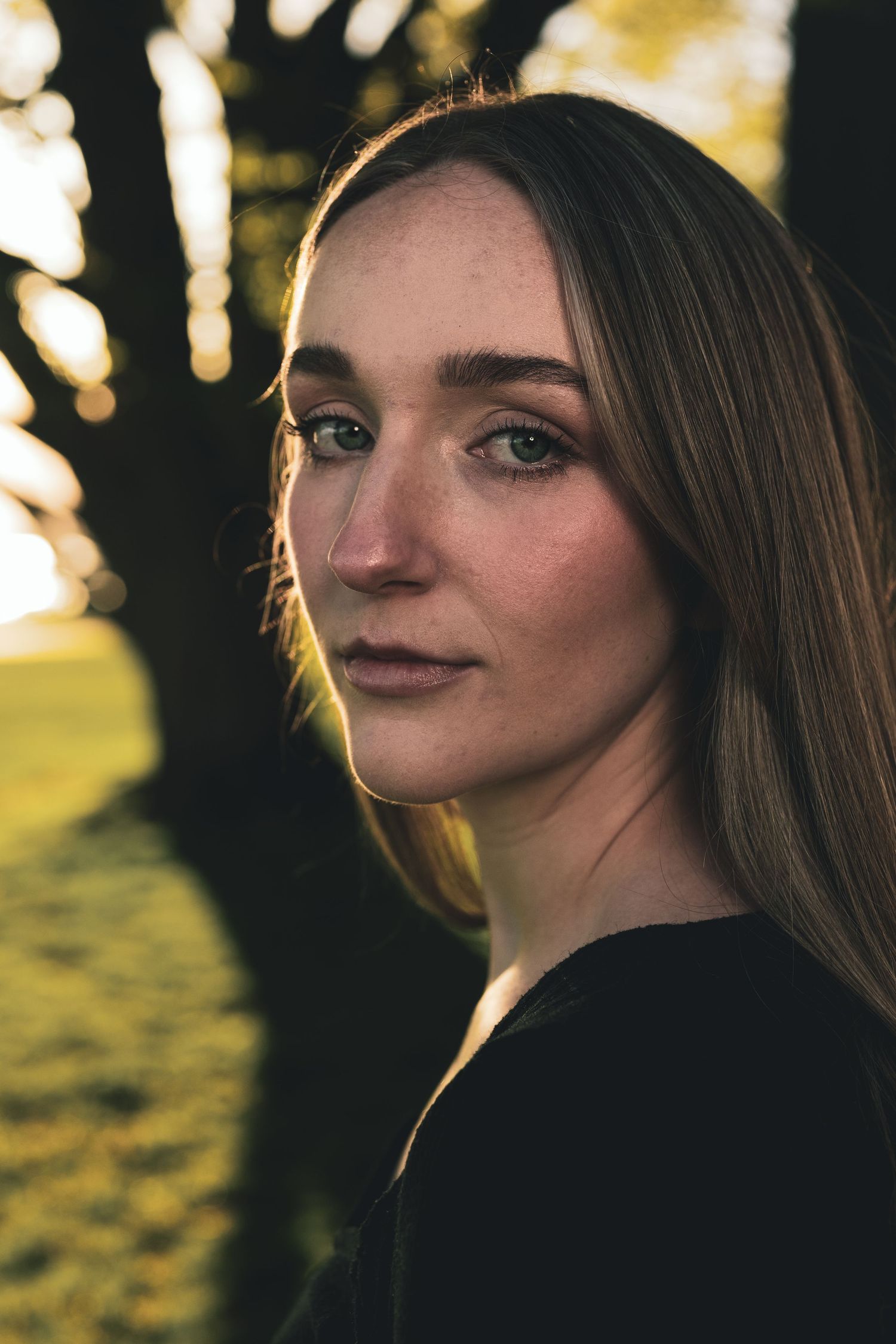 Artistic portrait sequence captured during golden hour with natural backlighting.