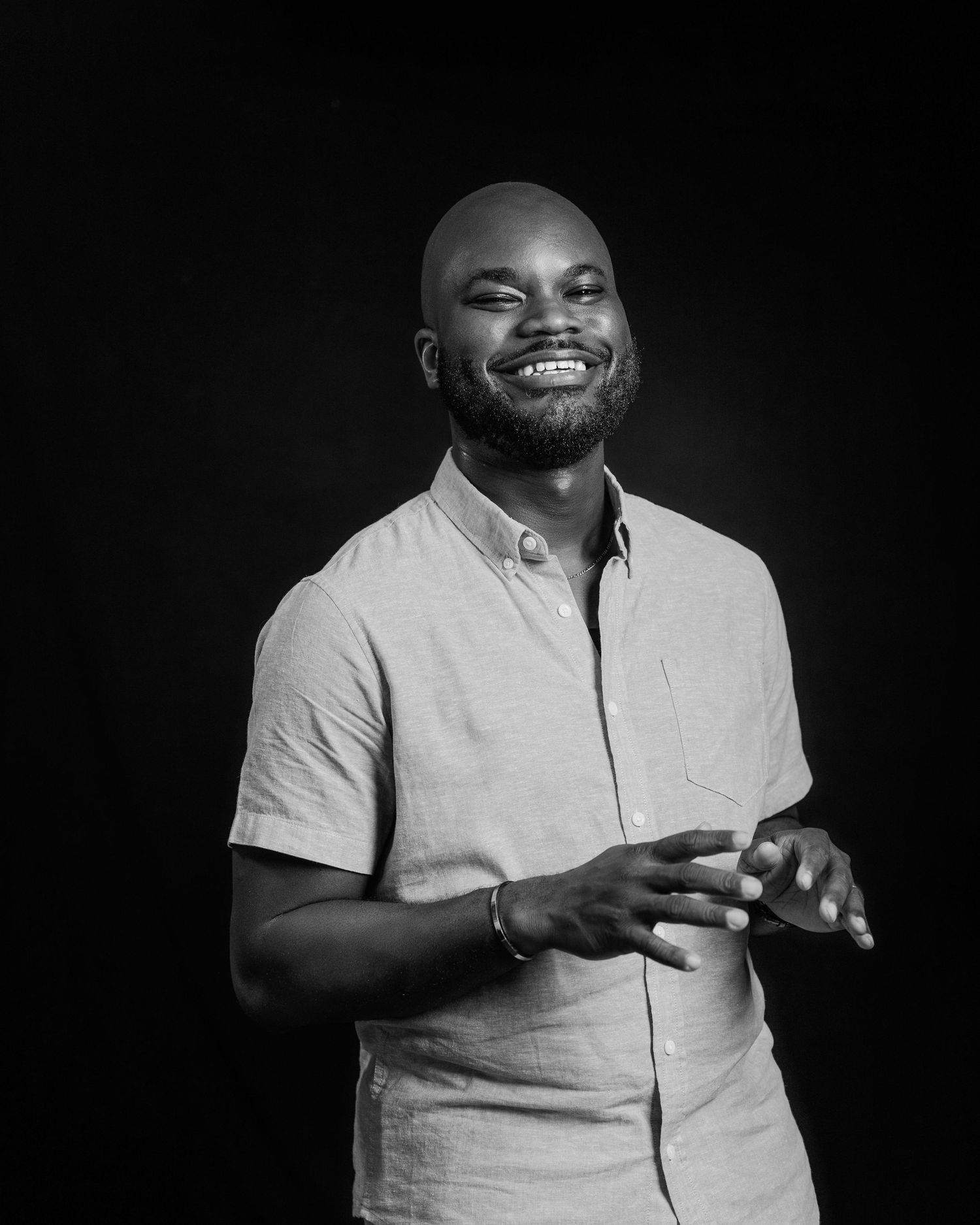 Black and white portrait series showing a person in a light colored polo shirt against a dark backdrop.