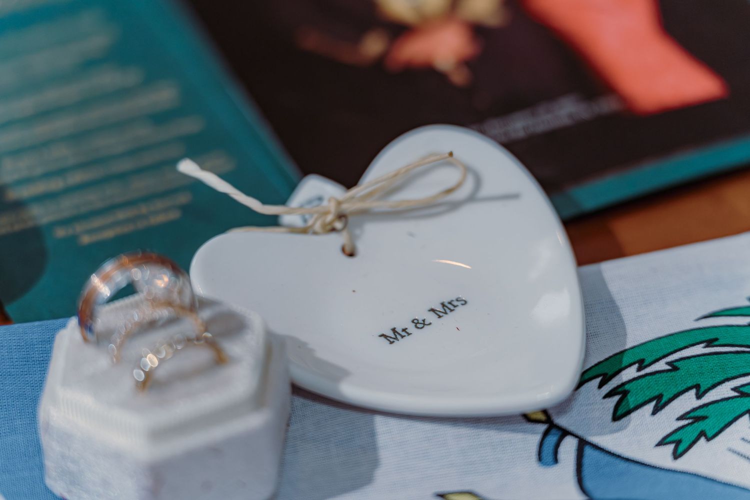 Wedding rings displayed on white surfaces with delicate details.