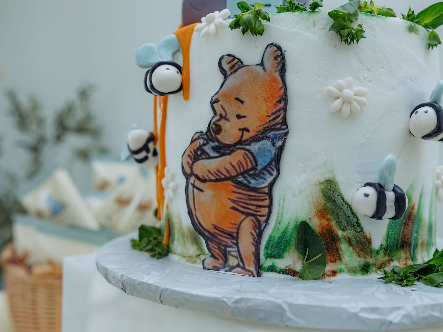 Cute cartoon bear illustrations painted on white porcelain dishes with delicate floral accents and decorative elements.