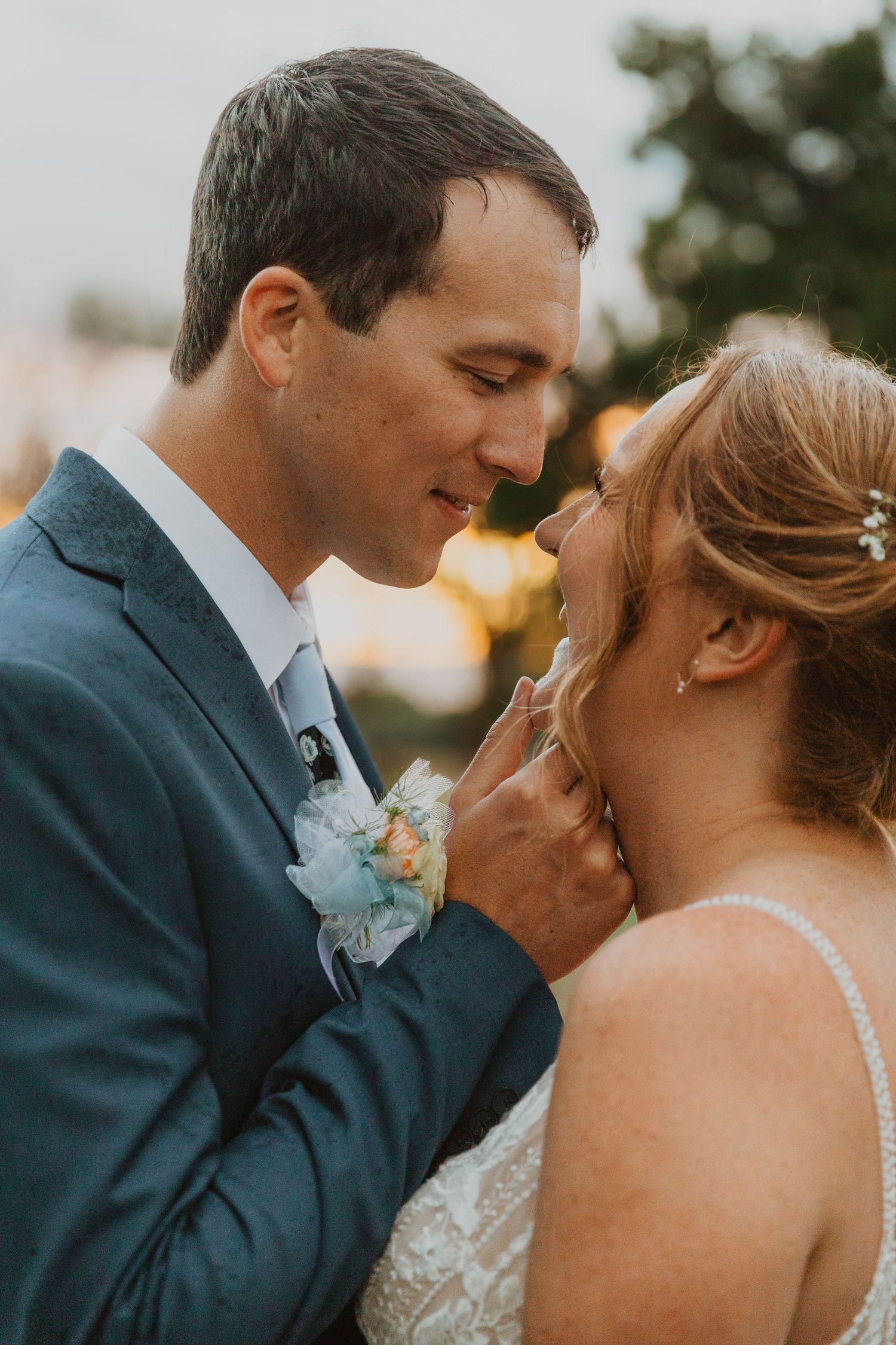 Utah Romantic sunset moment between newlyweds in formal wedding attire.