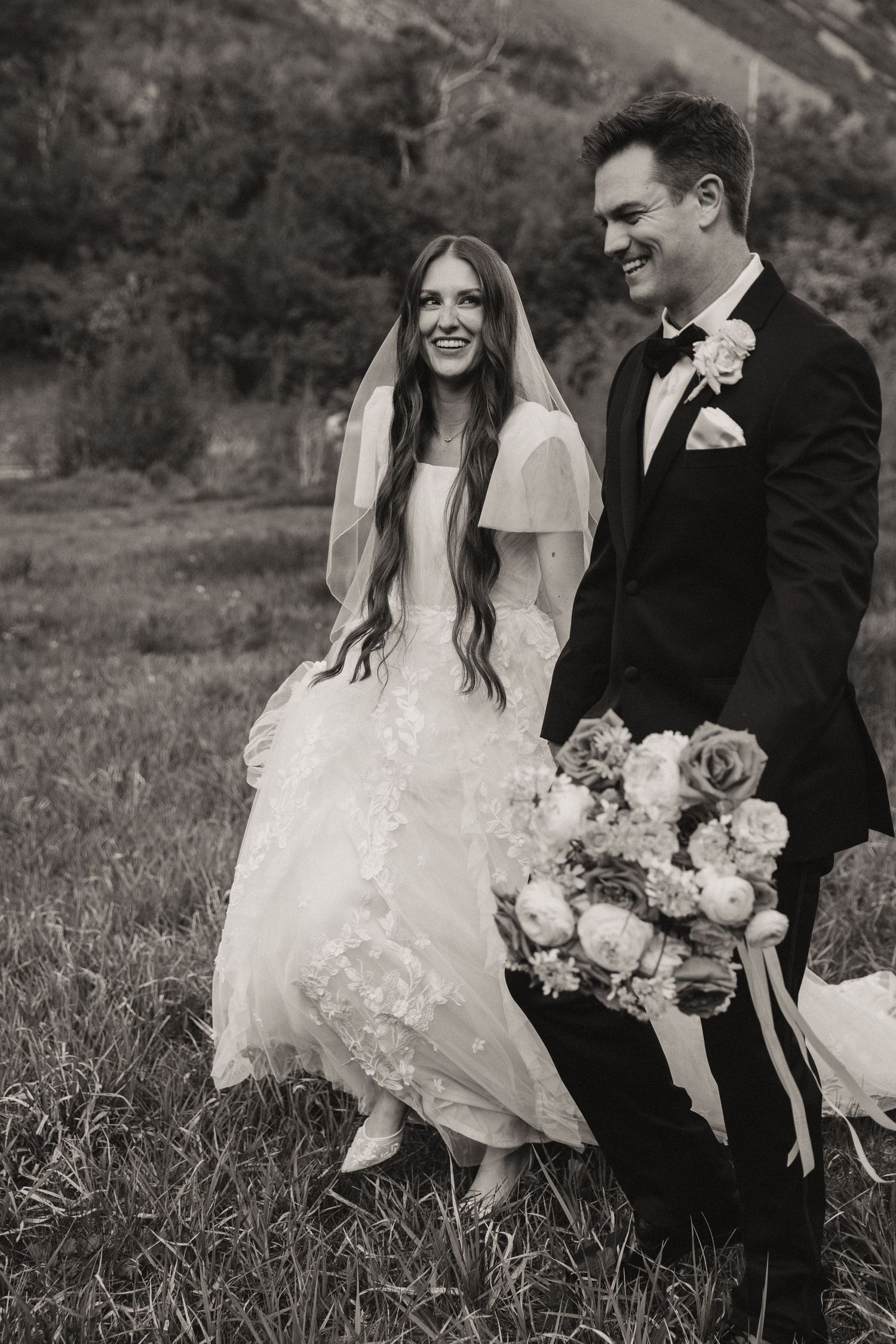 Bridal pictures in Utah county for couple getting married, in a field with wildflowers in Provo