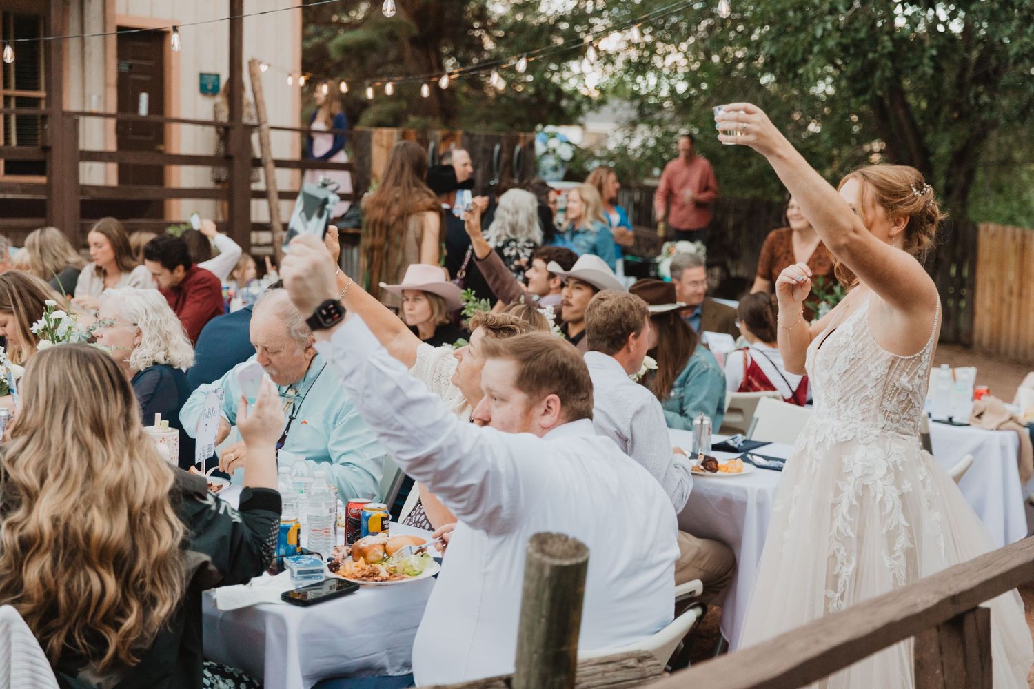 Bride and friends dance at wedding reception in Colorado