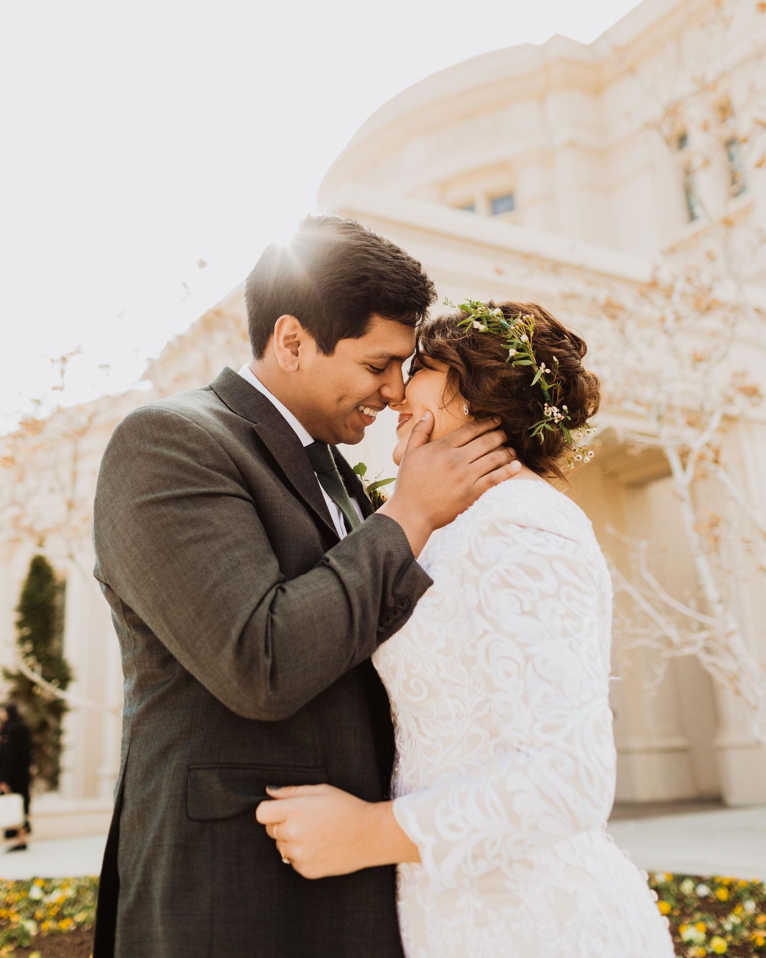 Utah wedding couple laughing together during portraits at the Payson Temple, LDS mormon wedding