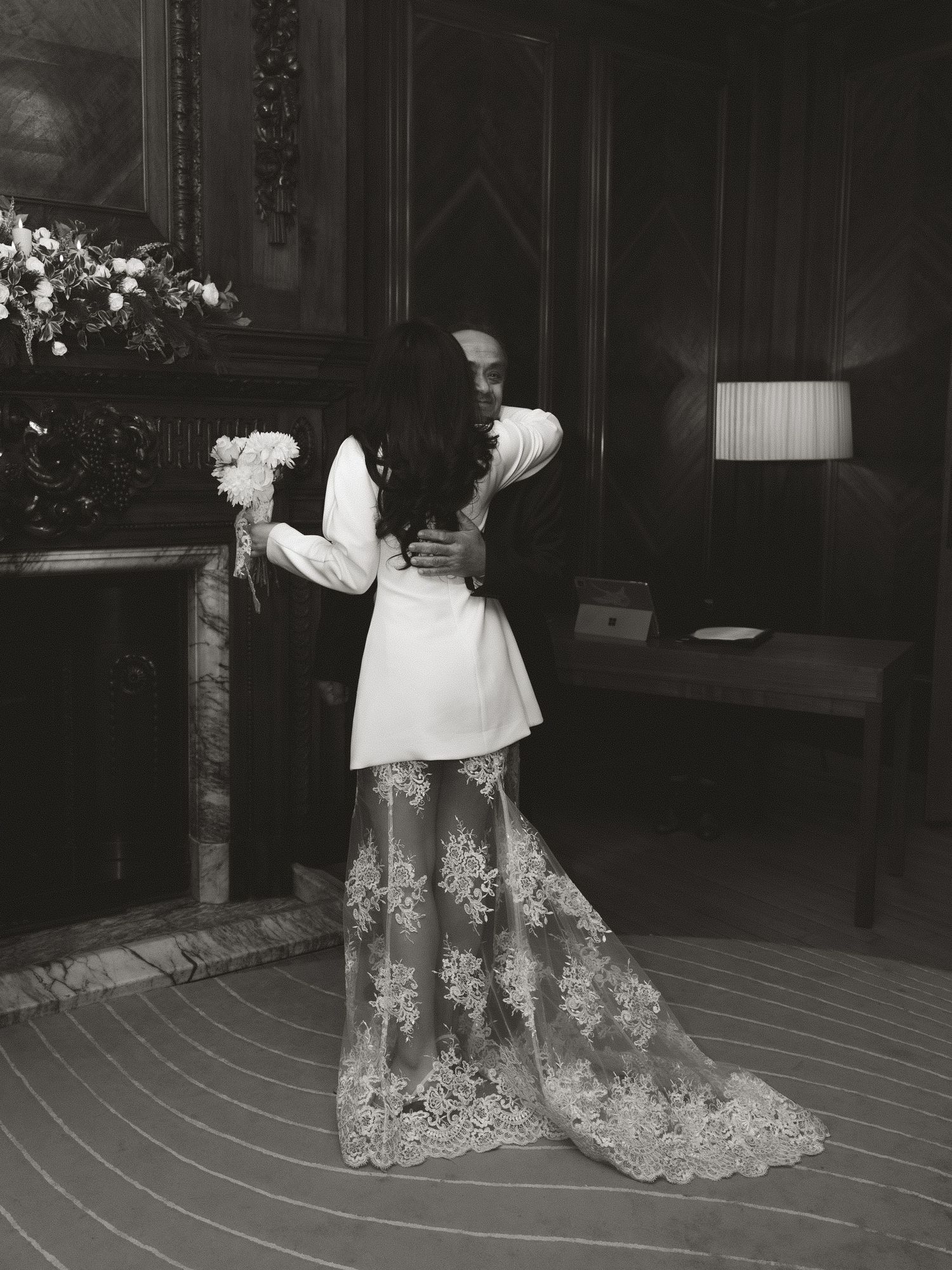 Black and white photo sequence showing the flowing lace details of a wedding dress against dark flooring.