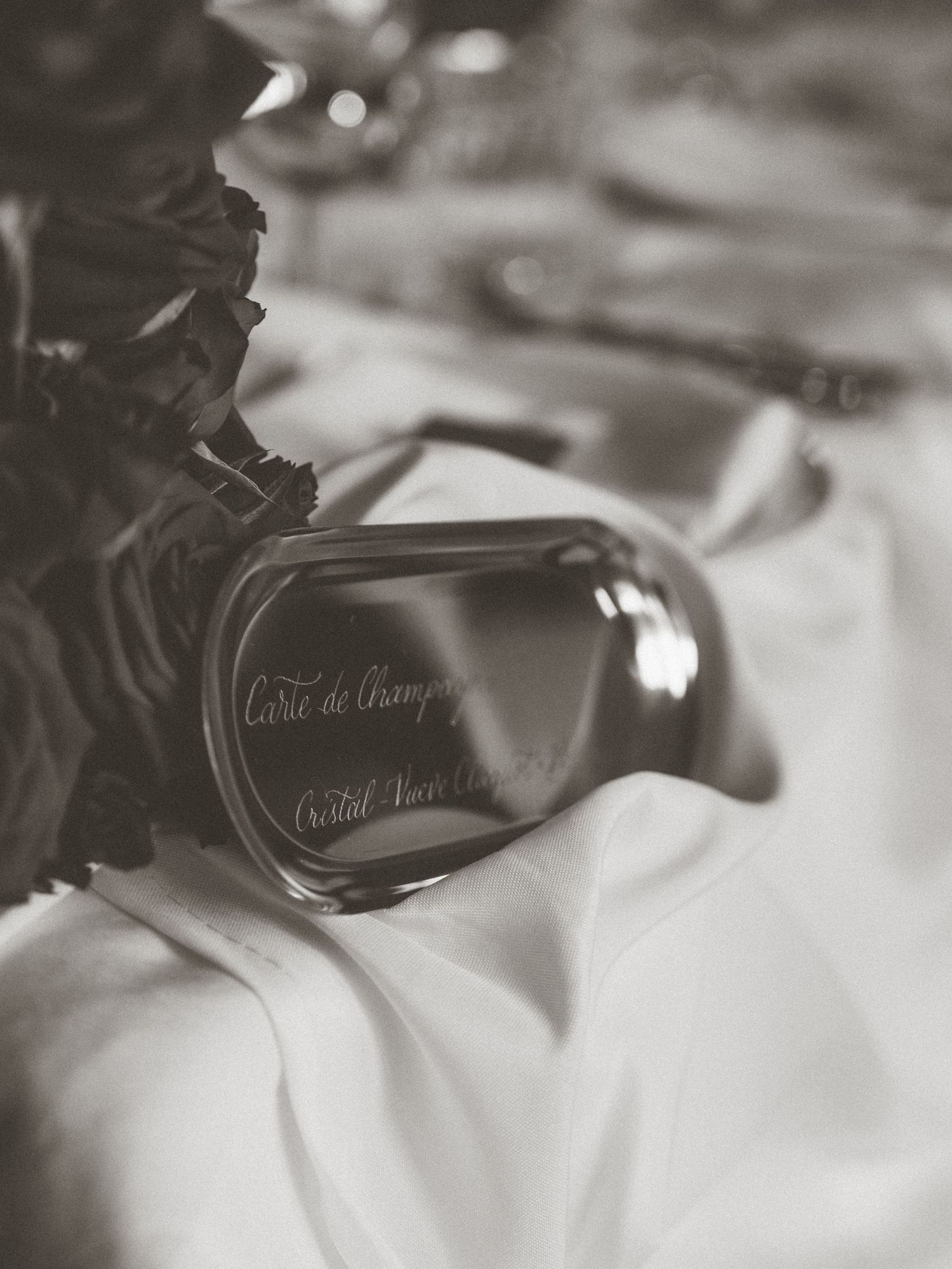 A series of black and white close-up photographs showing wedding rings and reflections in elegant monochromatic style.
