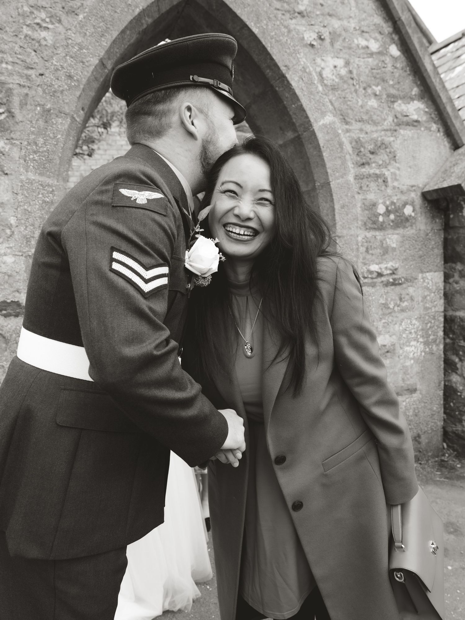Vintage military wedding photos against stone archway background.