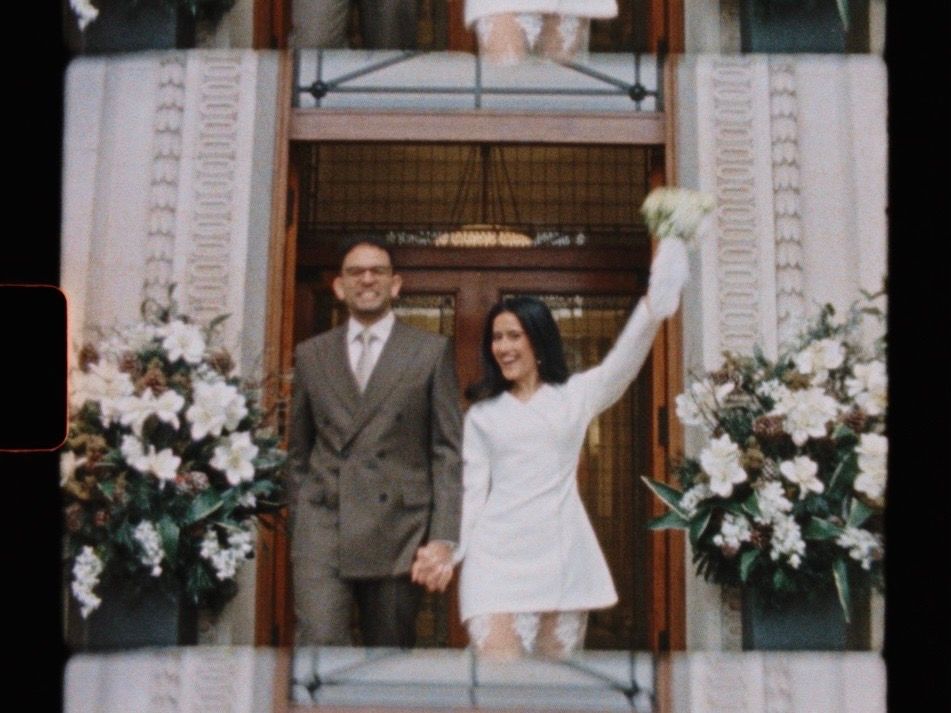 A series of wedding photos showing joyful moments between a couple at their ceremony with white floral decorations.