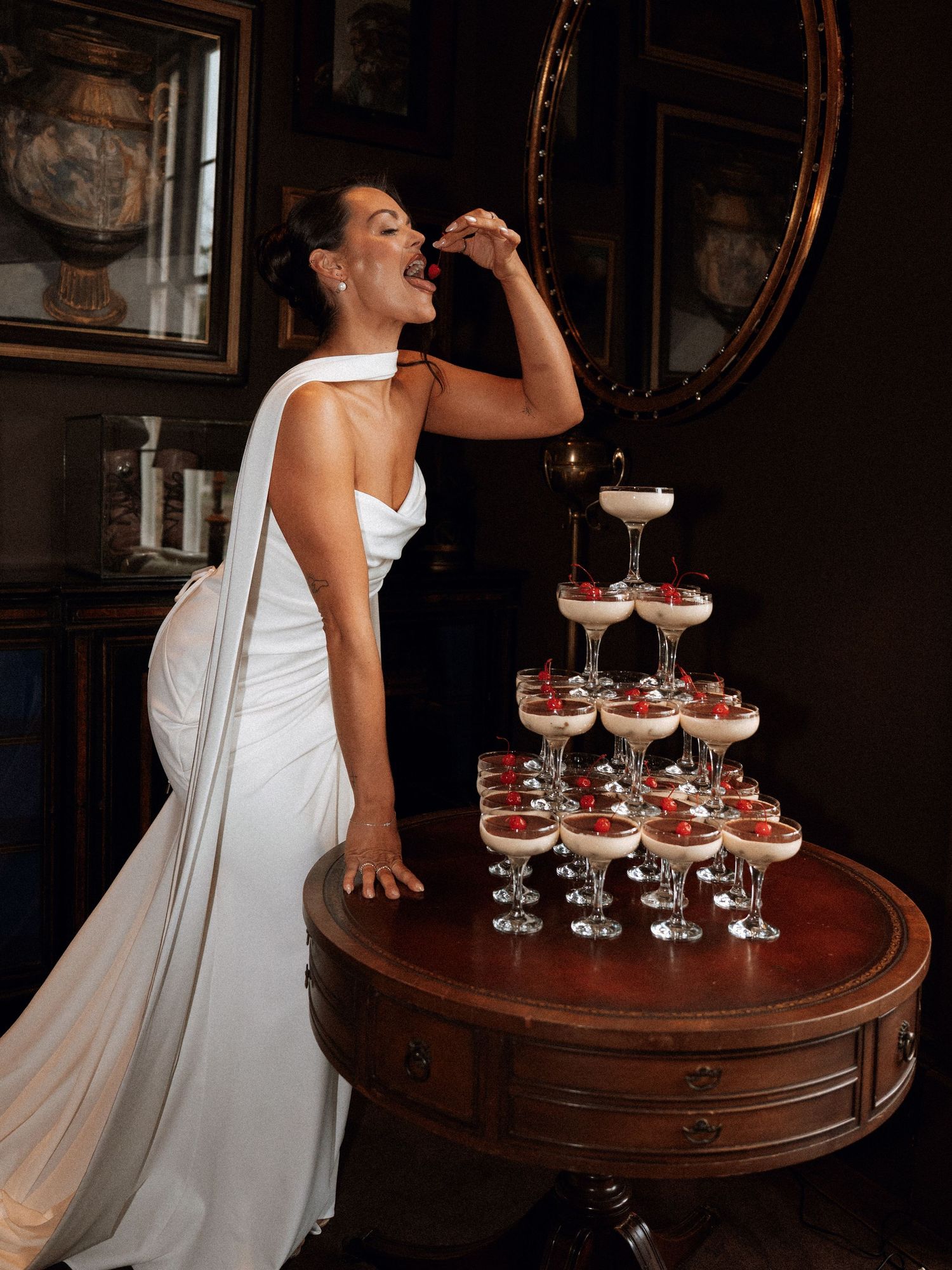Wedding celebration with champagne tower on antique round table.