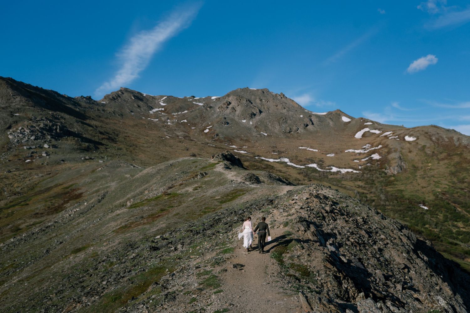 Couple exchanging vows during a romantic Denali National Park elopement in Alaska surrounded by breathtaking wilderness.