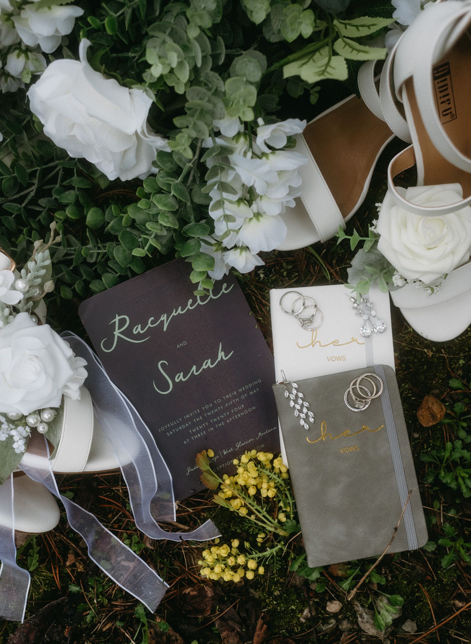 Close-up shots of the bride’s wedding details—flowers, rings, heels, vows, and earrings—captured in Glacier National Park, Montana.