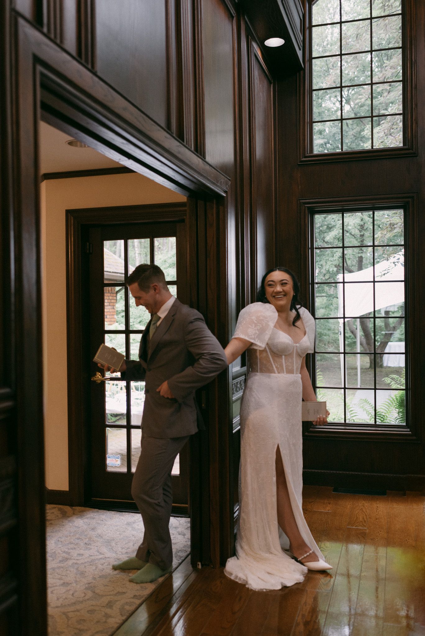 Couple exchanging private, intimate vows while facing away from the camera inside Huffman Manor, Fairbanks, Alaska.