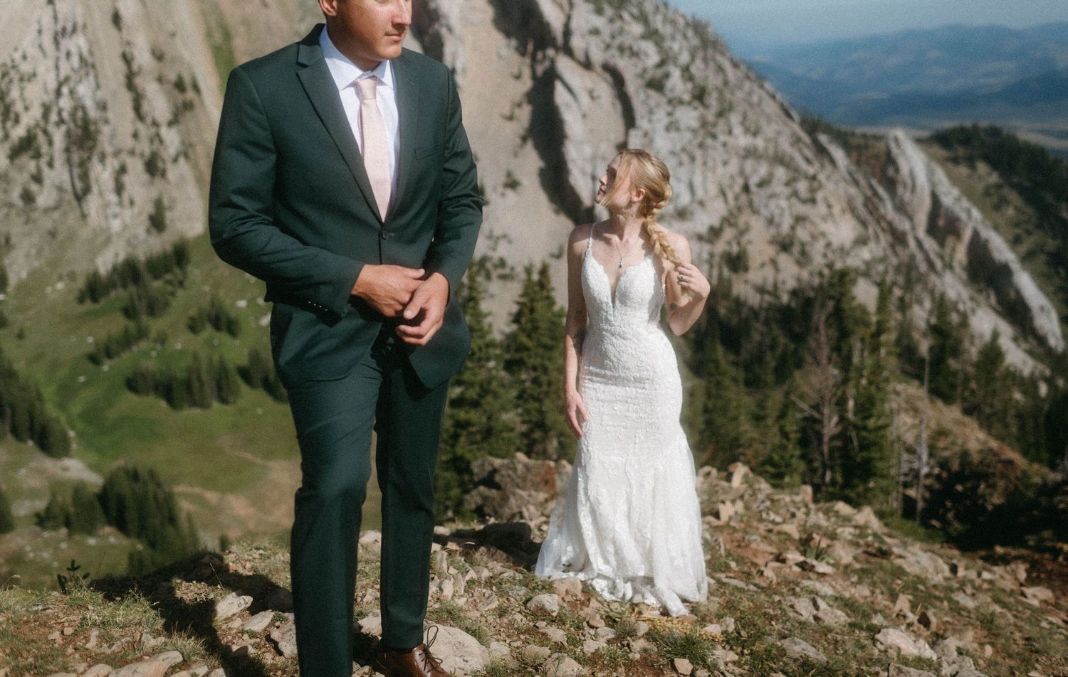 Bride and groom standing in the mountains during their elopement wedding in Montana.