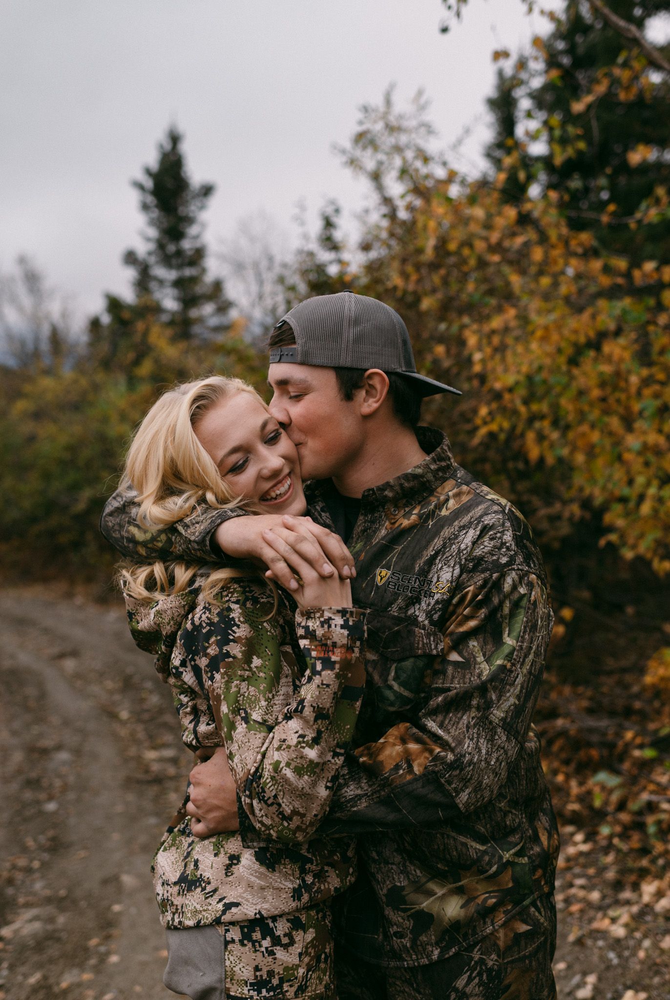 Couple embracing outdoors in fall foliage, Fairbanks, Alaska.