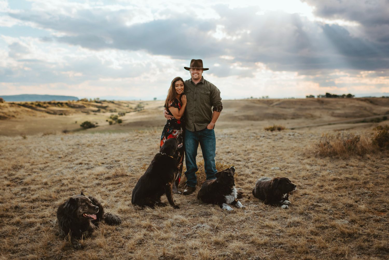 Family portrait with 4 dogs in Great Falls, Montana, on a sunny day.