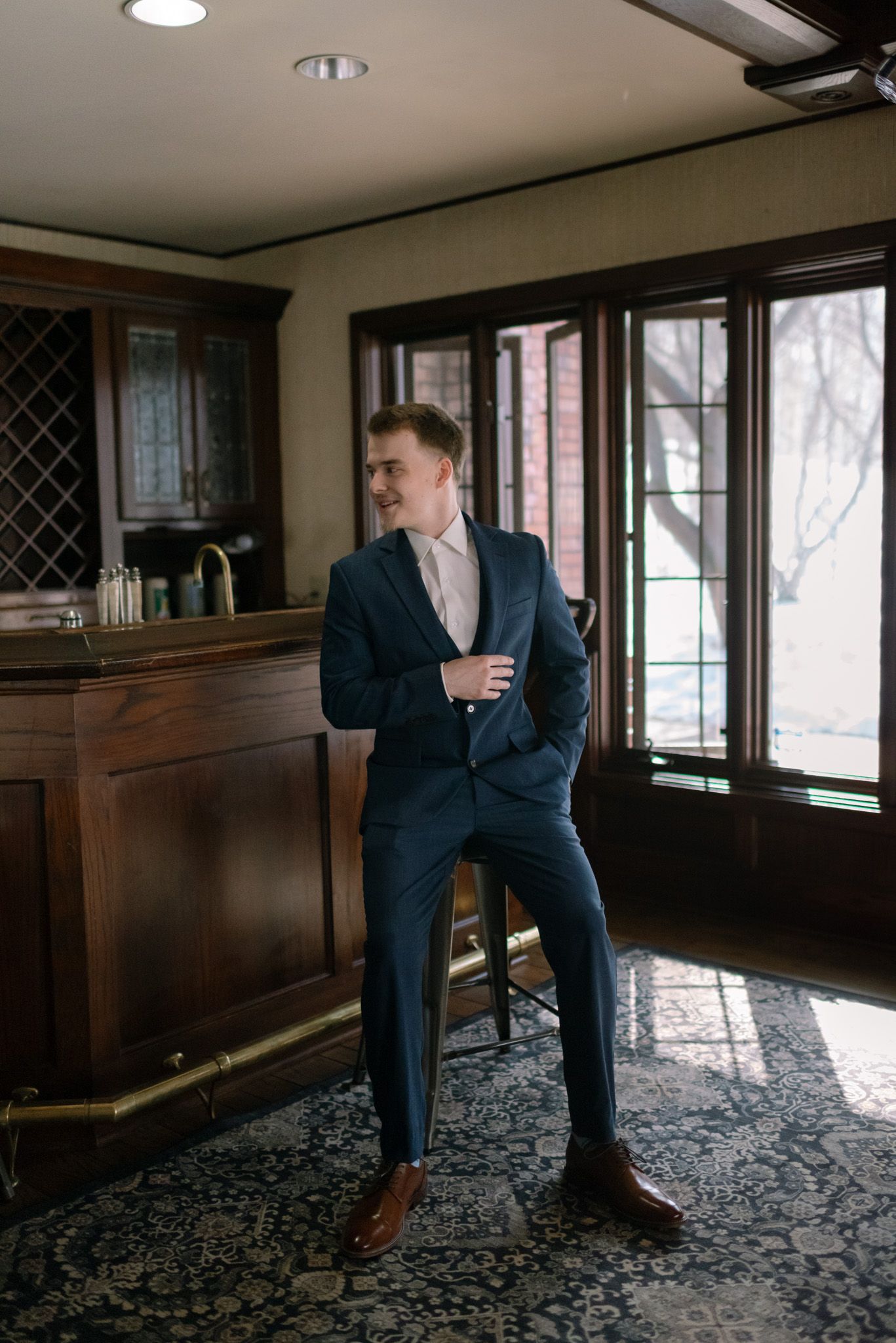 Groom portrait on wedding day in Fairbanks, Alaska, capturing a confident and emotional moment.
